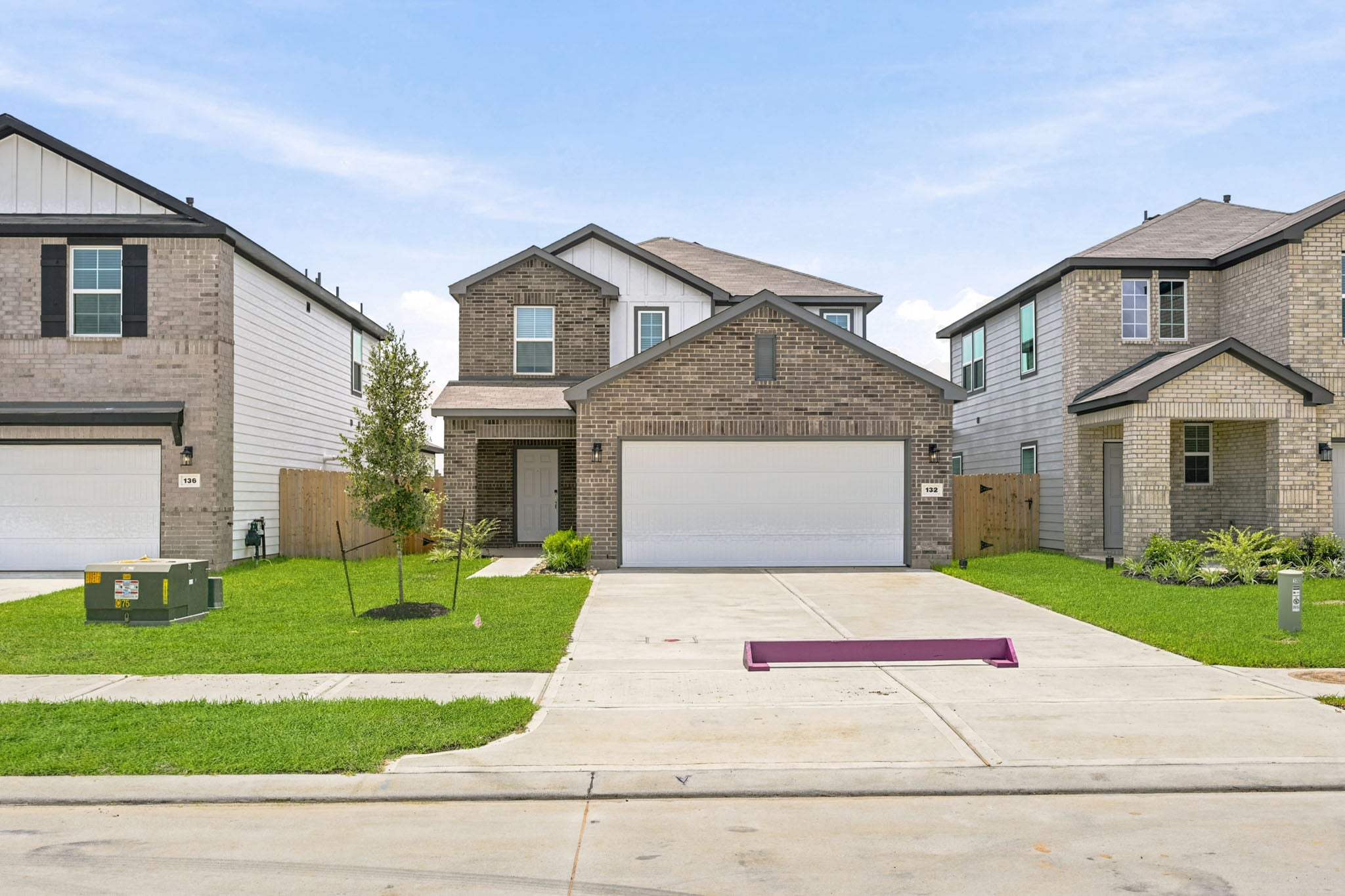 A driveway leading to a house.