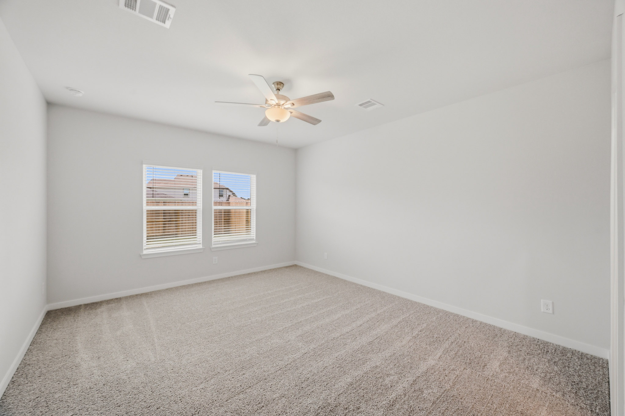 A ceiling fan in a room.