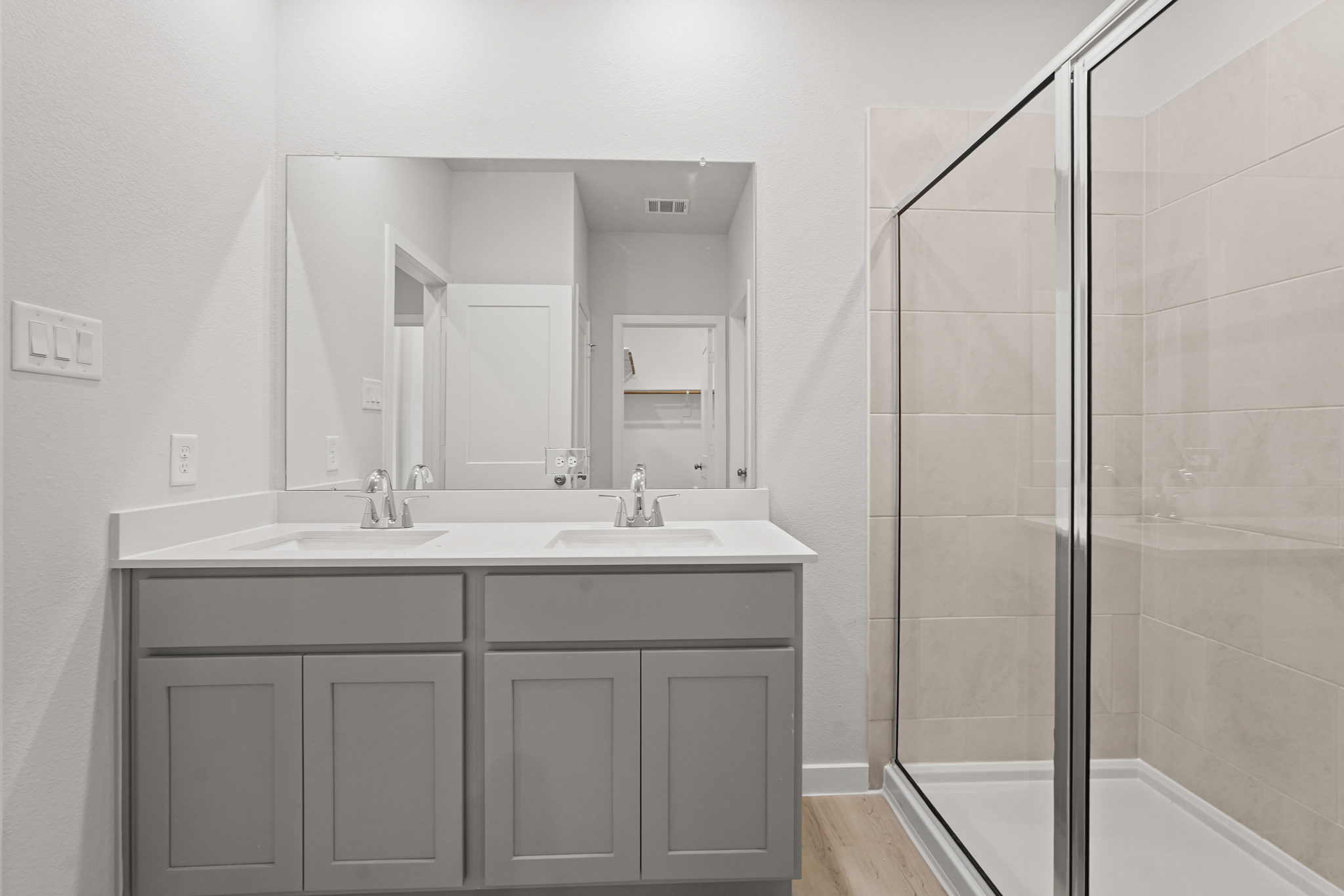 A bathroom with a glass shower.