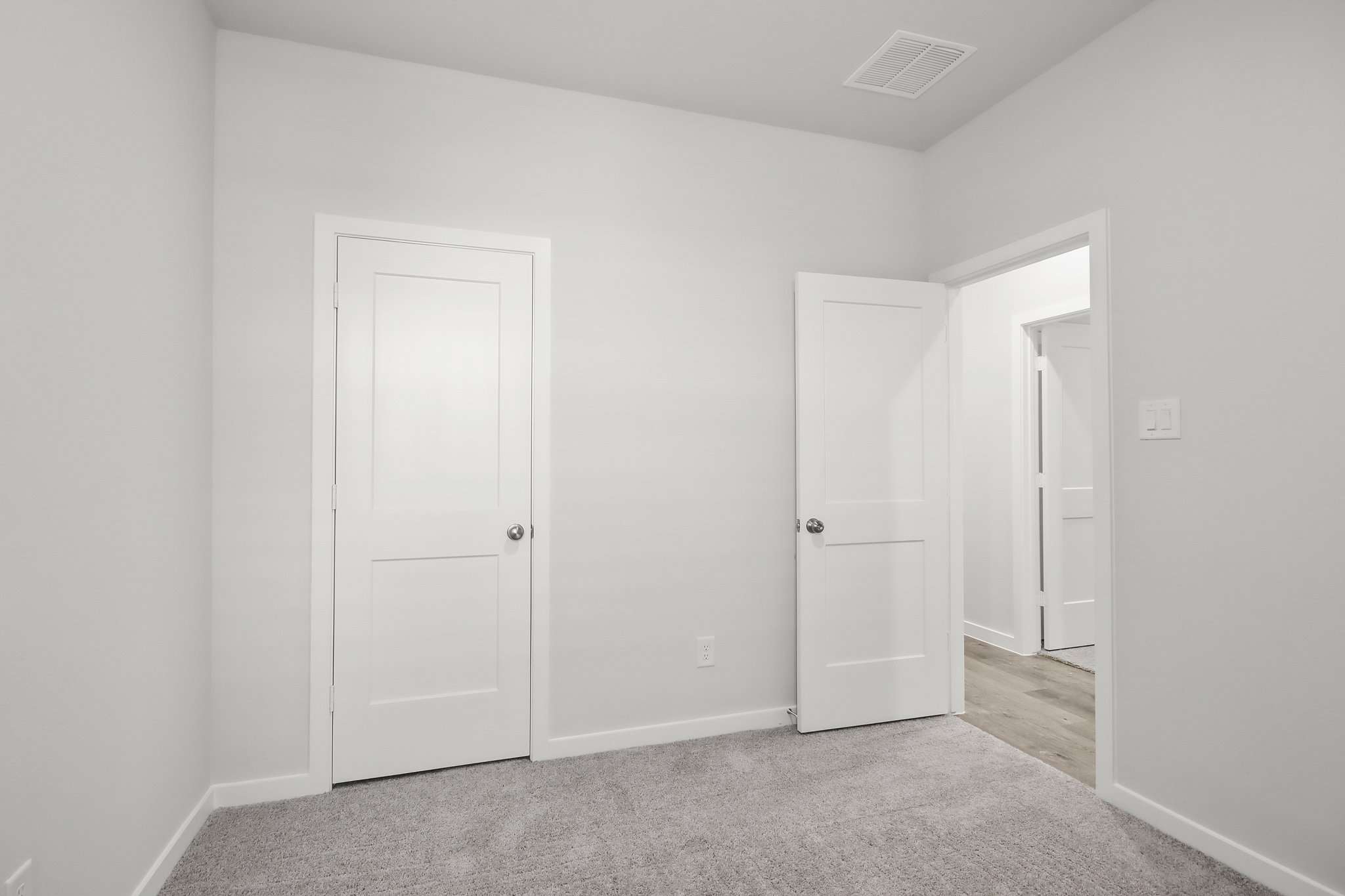A room with white doors.