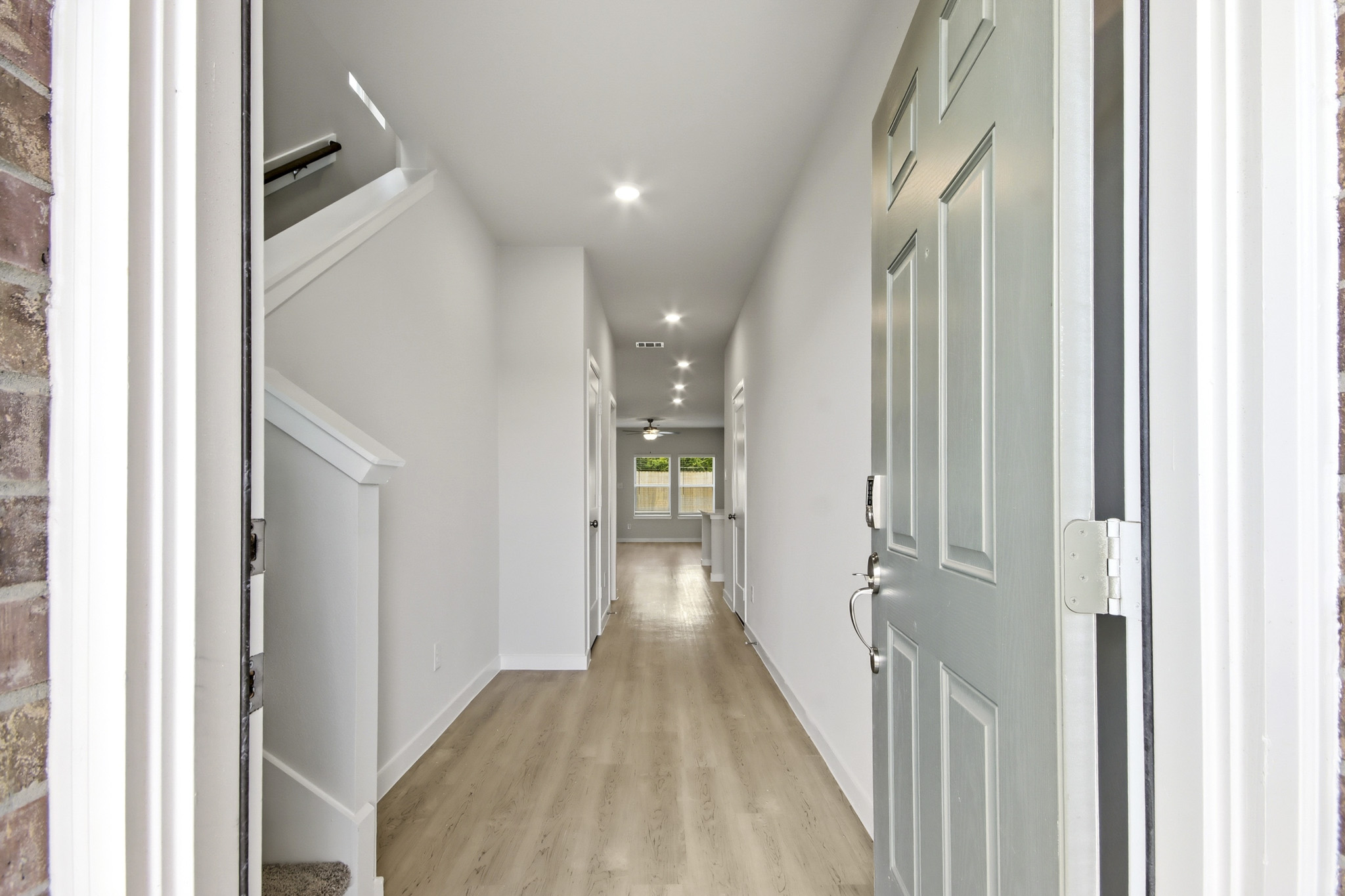 A hallway with white doors.