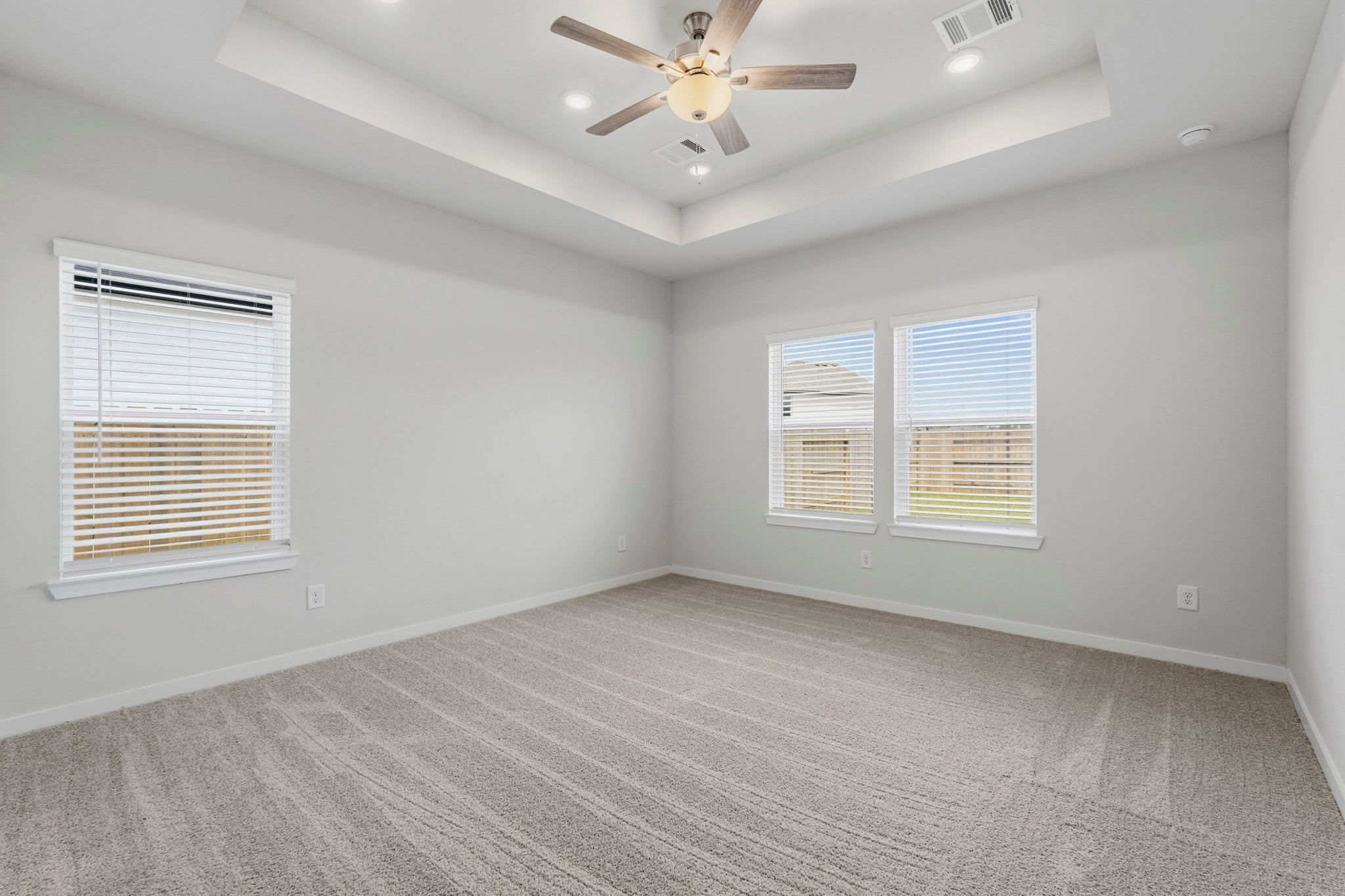 A room with a ceiling fan and a ceiling fan.