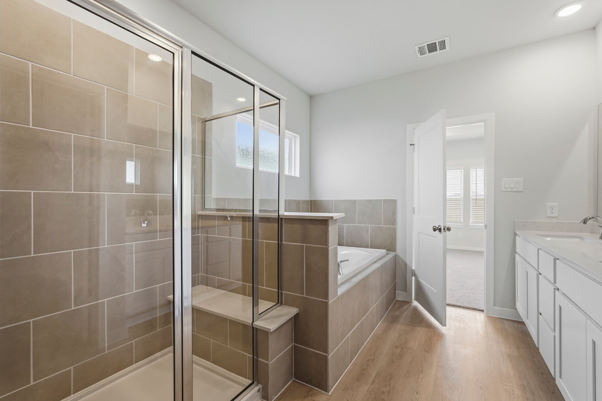 A bathroom with a glass shower.