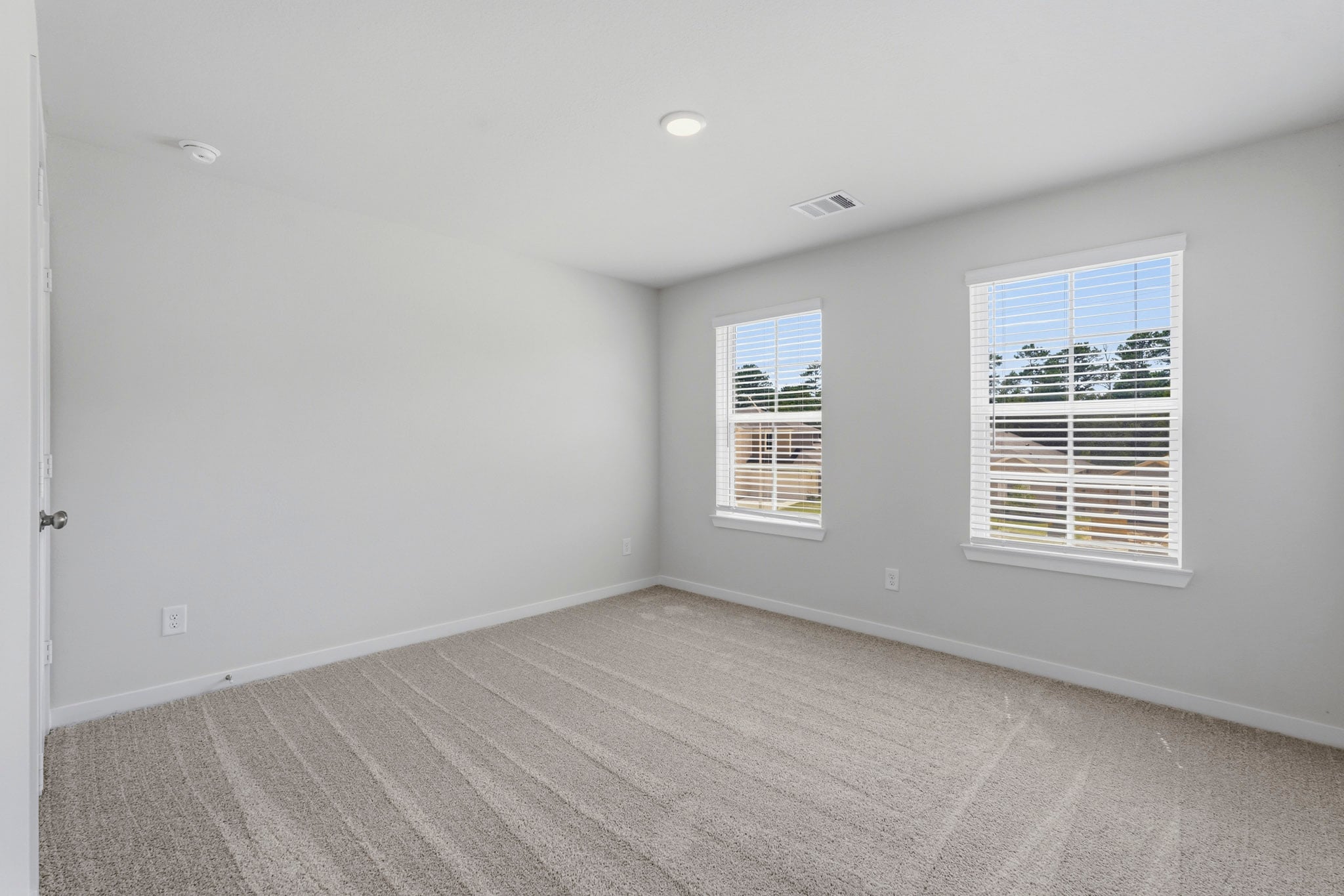 A room with a window and a door.