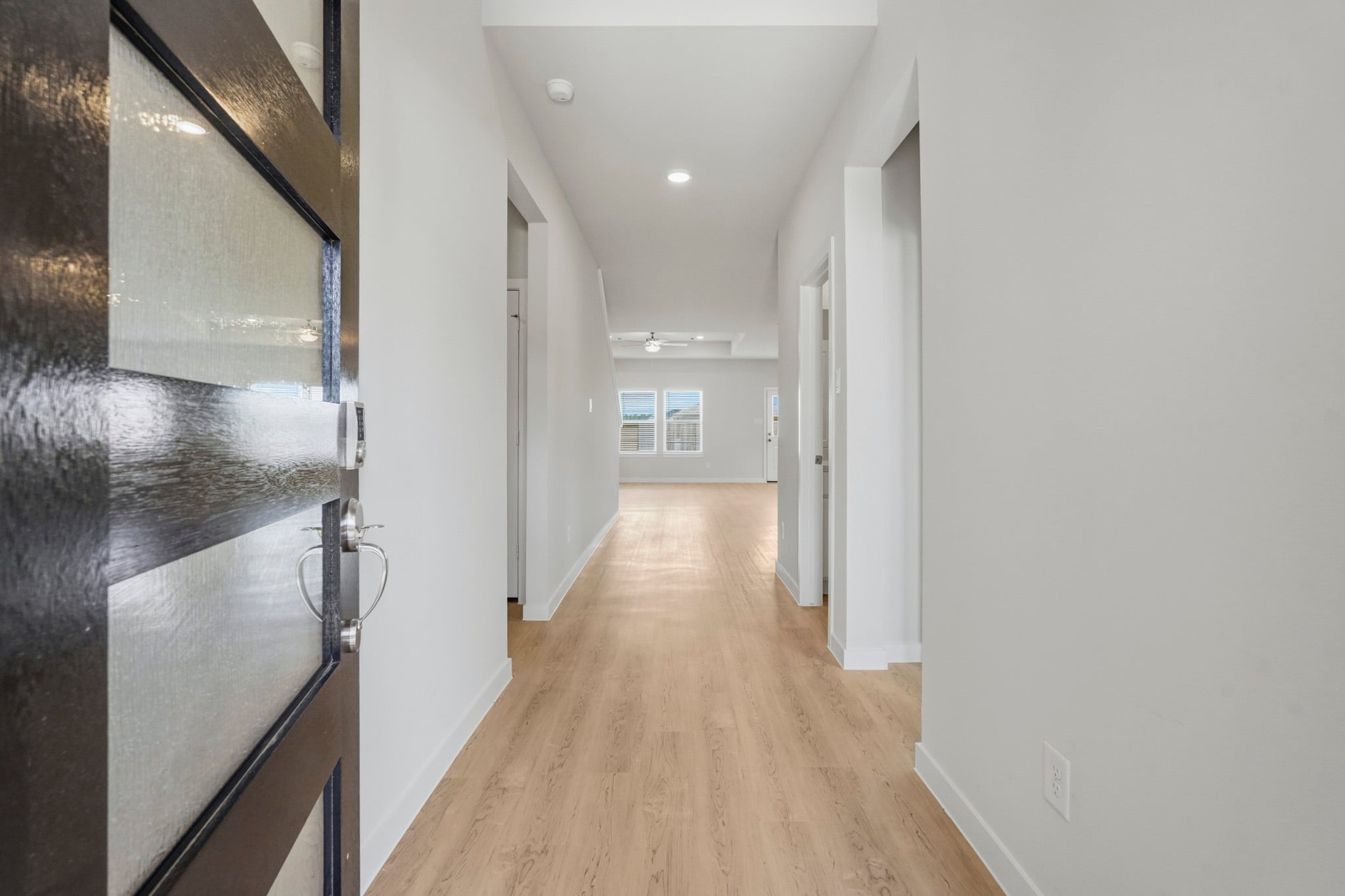 A hallway with white walls.