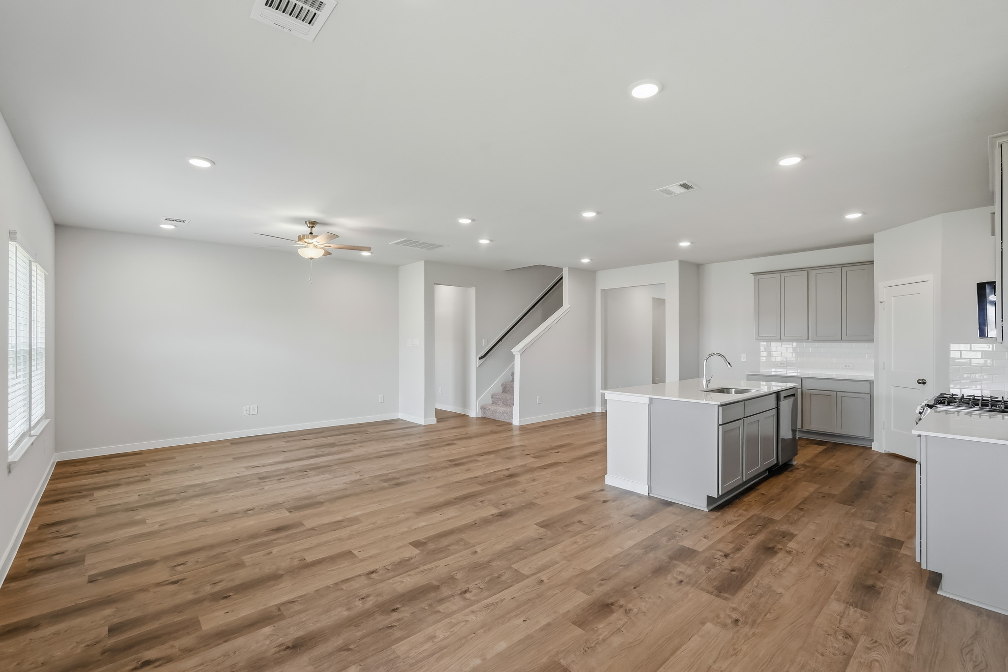 A large kitchen with white cabinets.