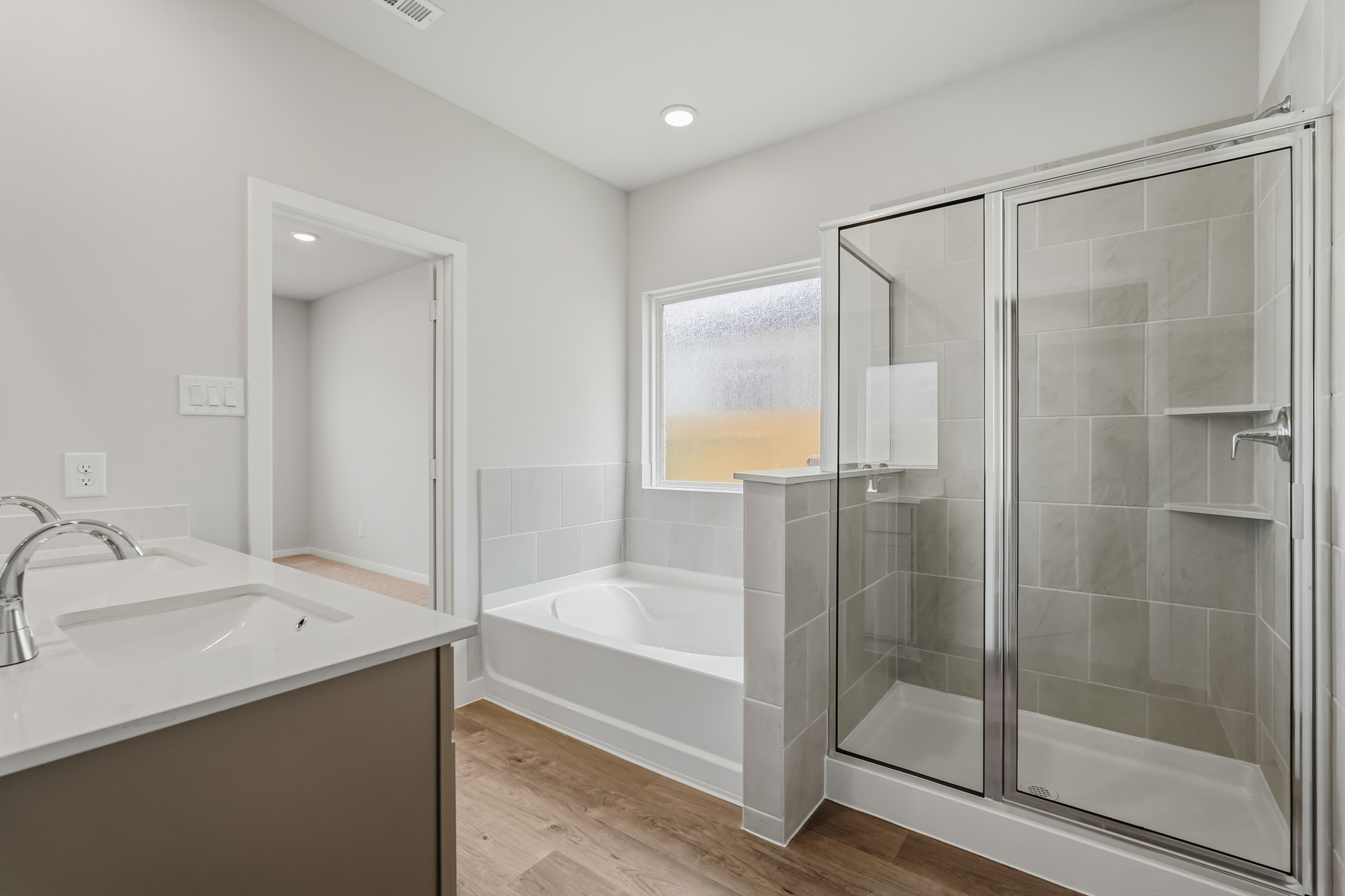 A bathroom with a glass shower.