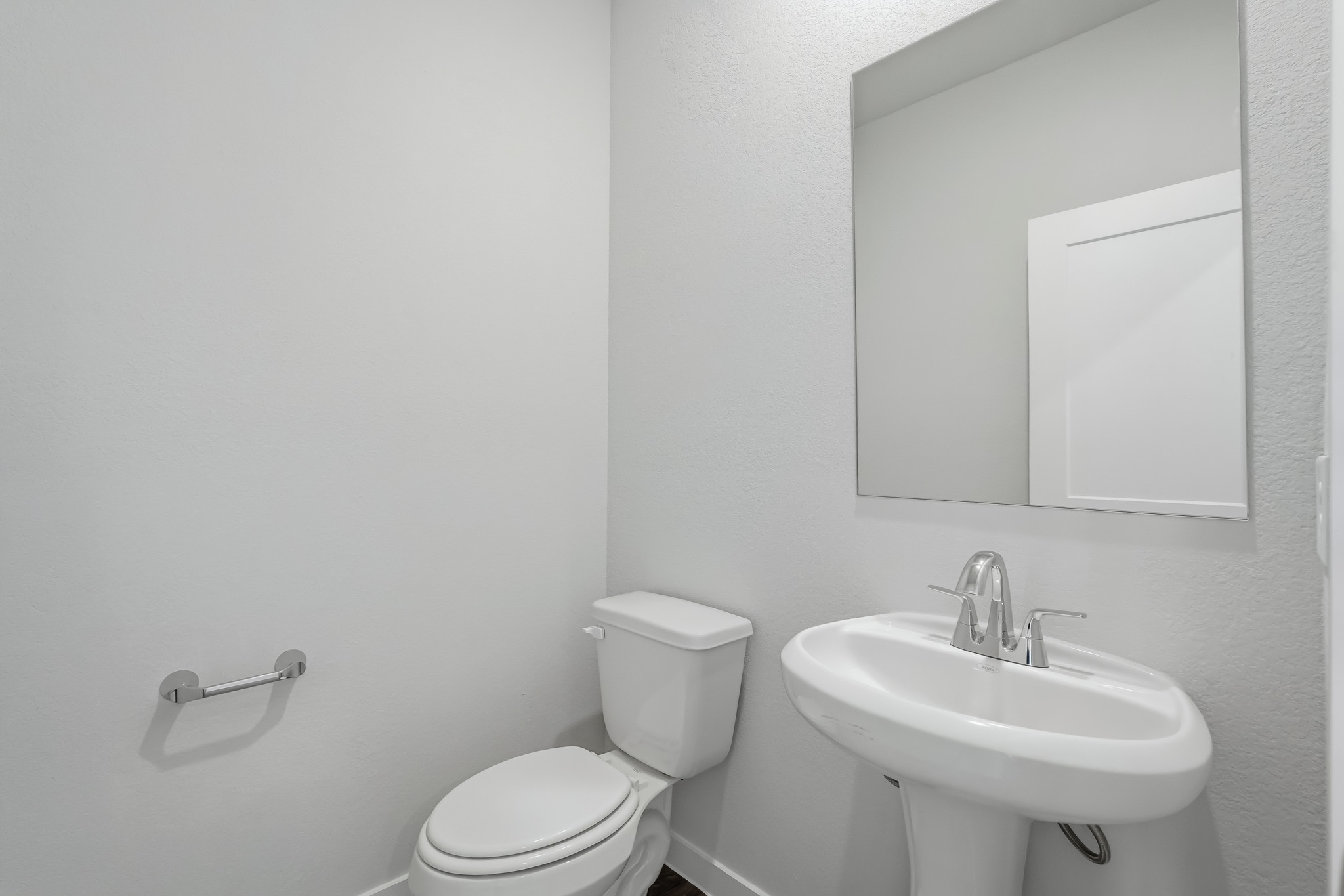 A bathroom with a sink and toilet.