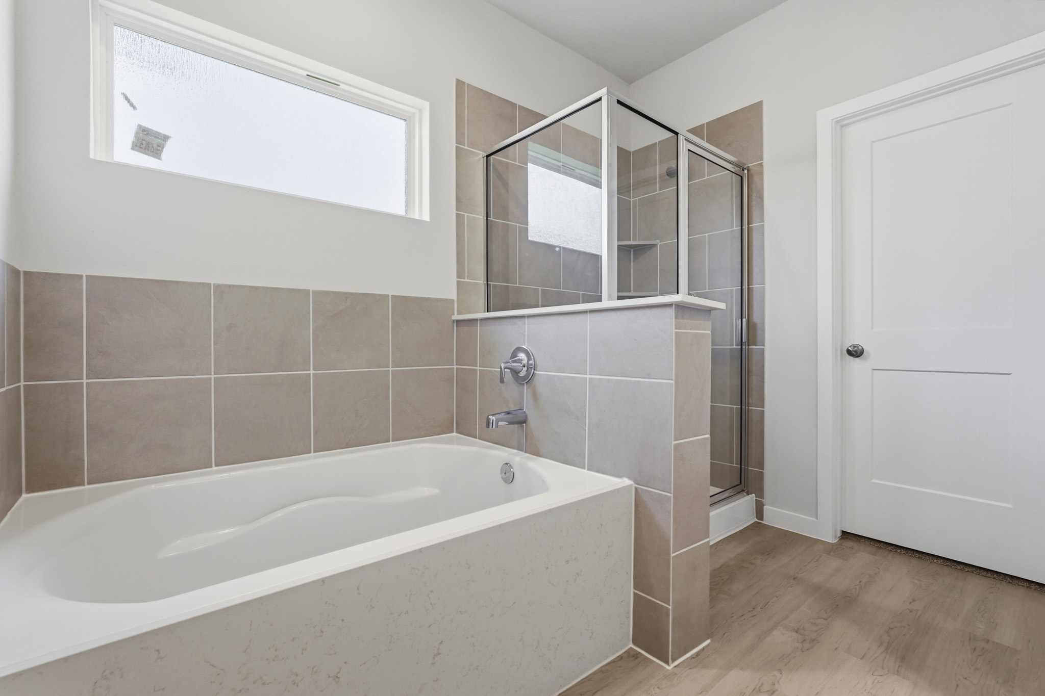 A bathroom with a glass shower.