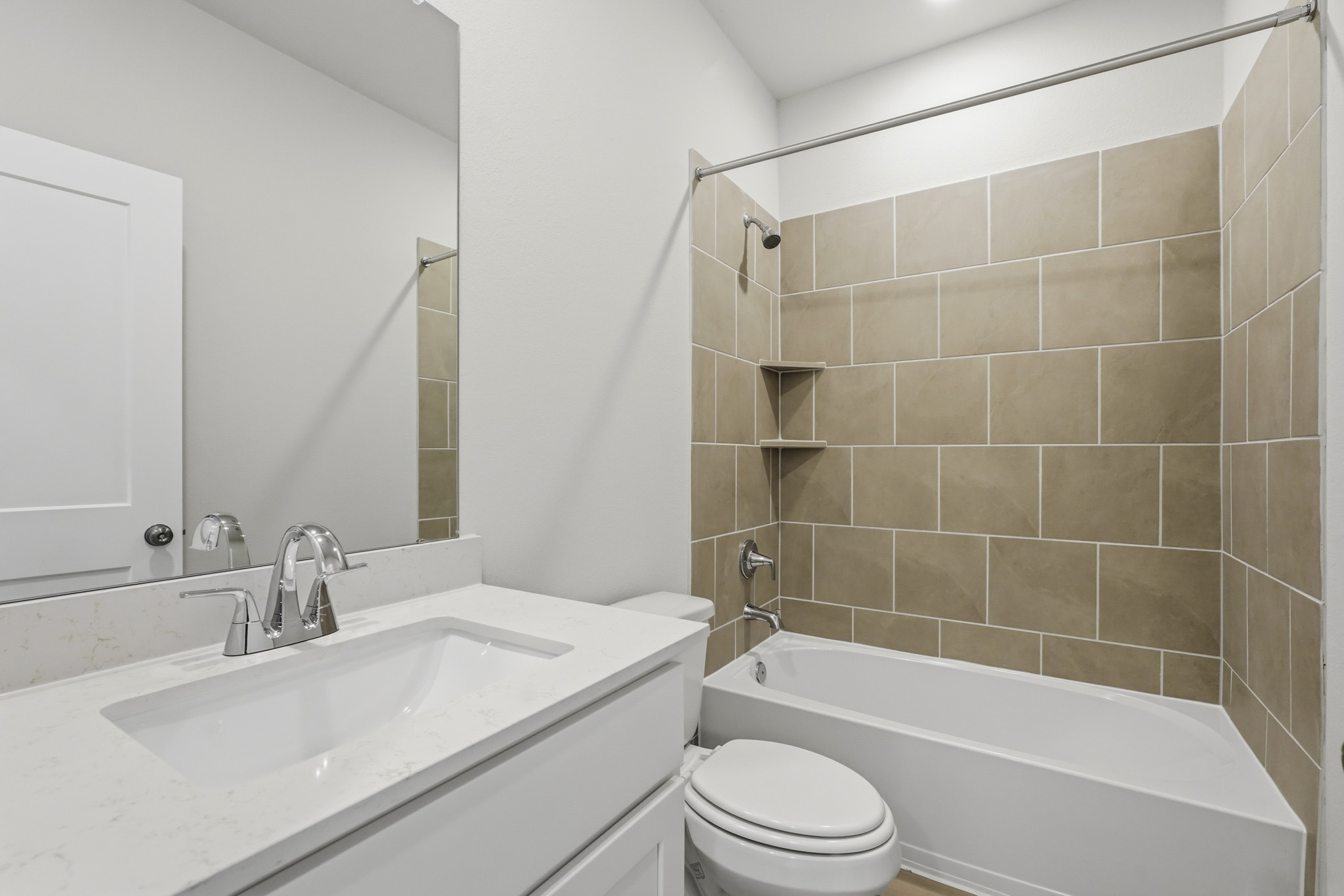 A bathroom with a sink and a toilet.