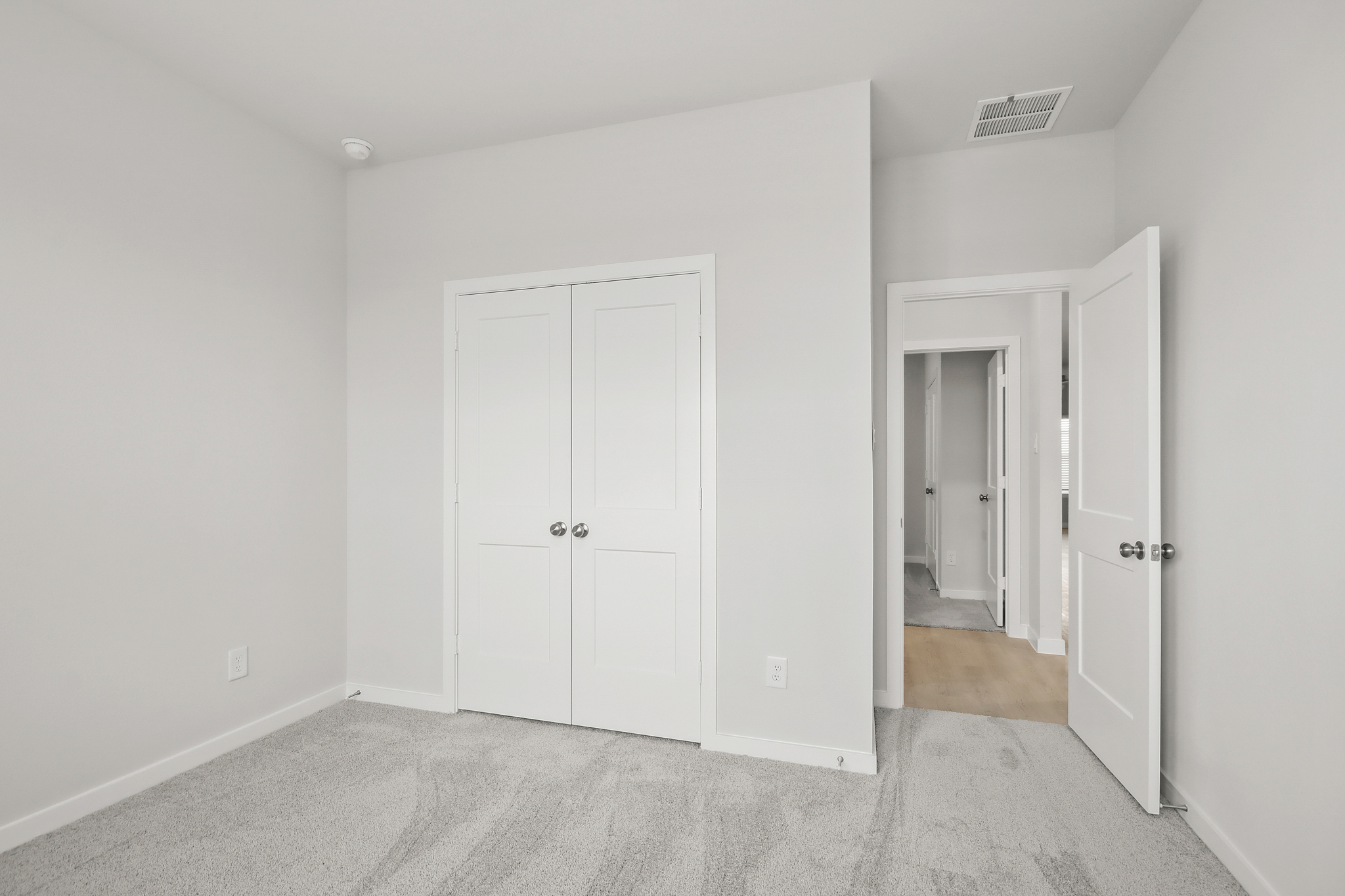 A room with white doors.