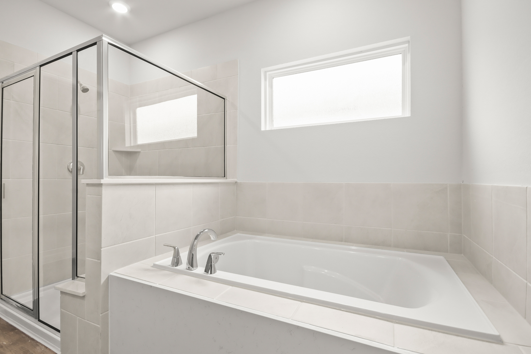 A bathroom with a glass shower.