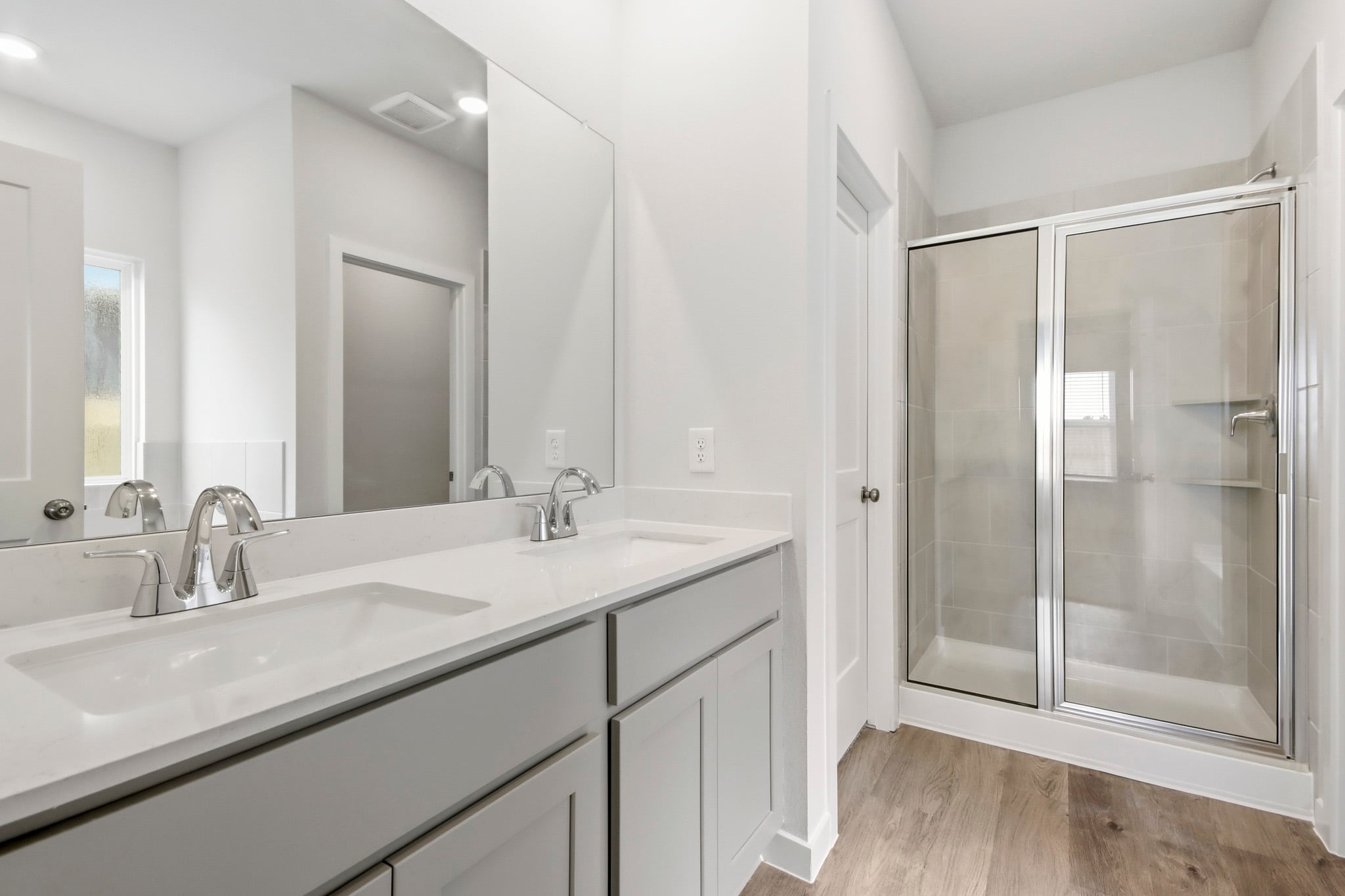 A bathroom with a glass shower.