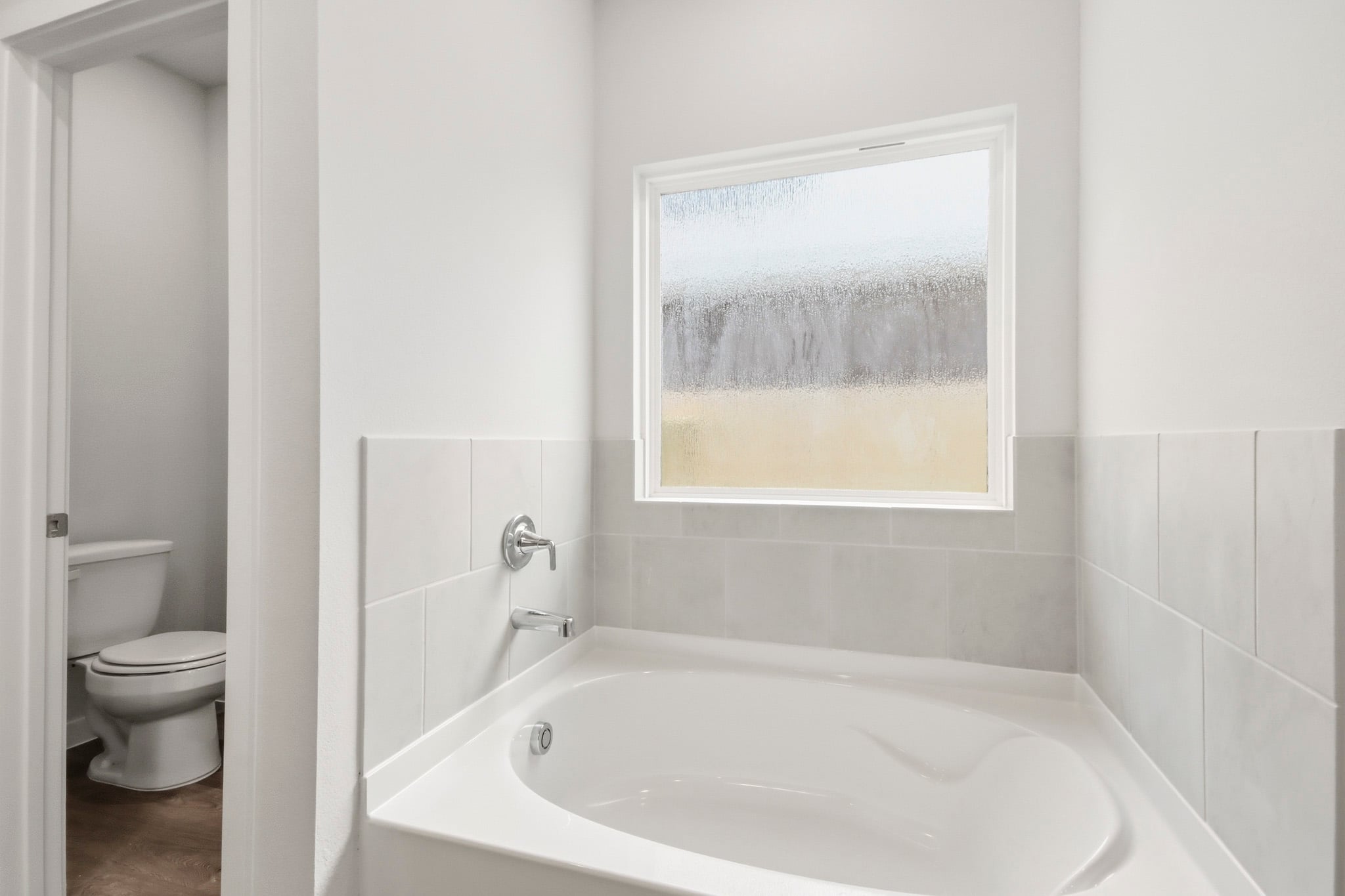 A bathtub in a bathroom.