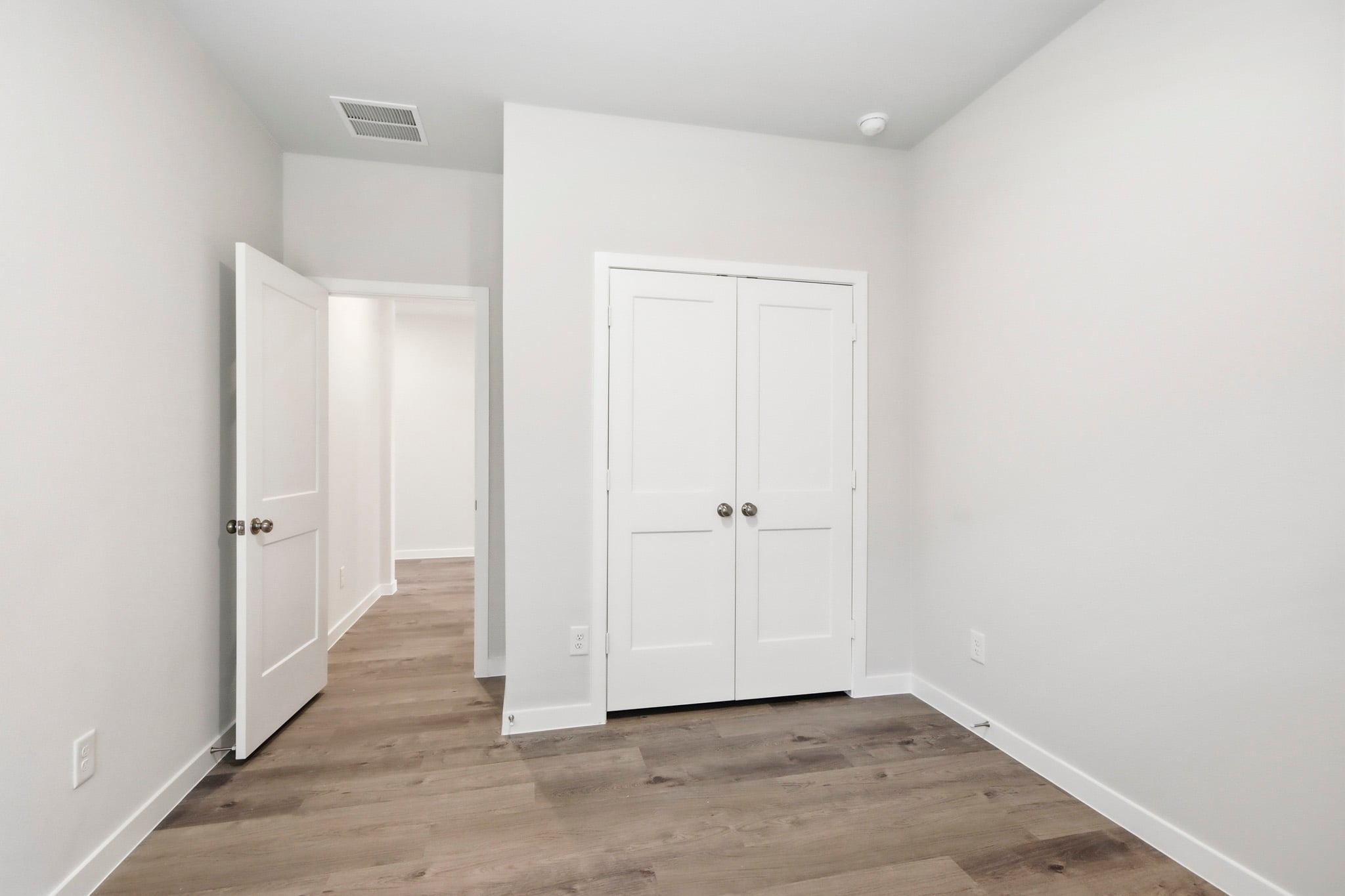 A room with white doors.