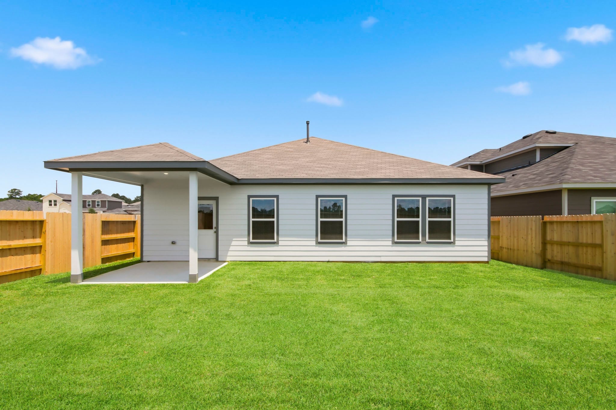A house with a grass yard.