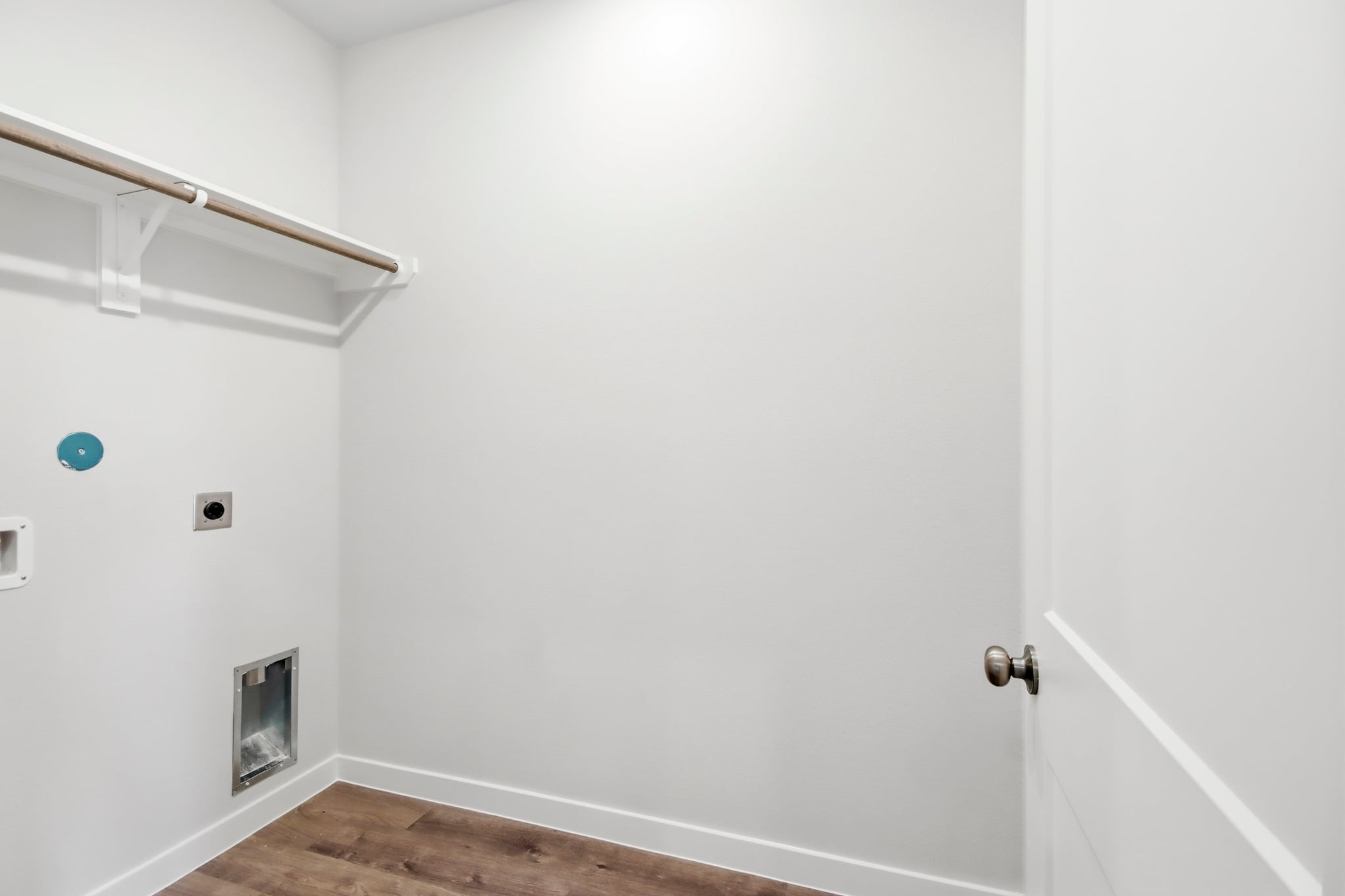 A white door with a blue ball.