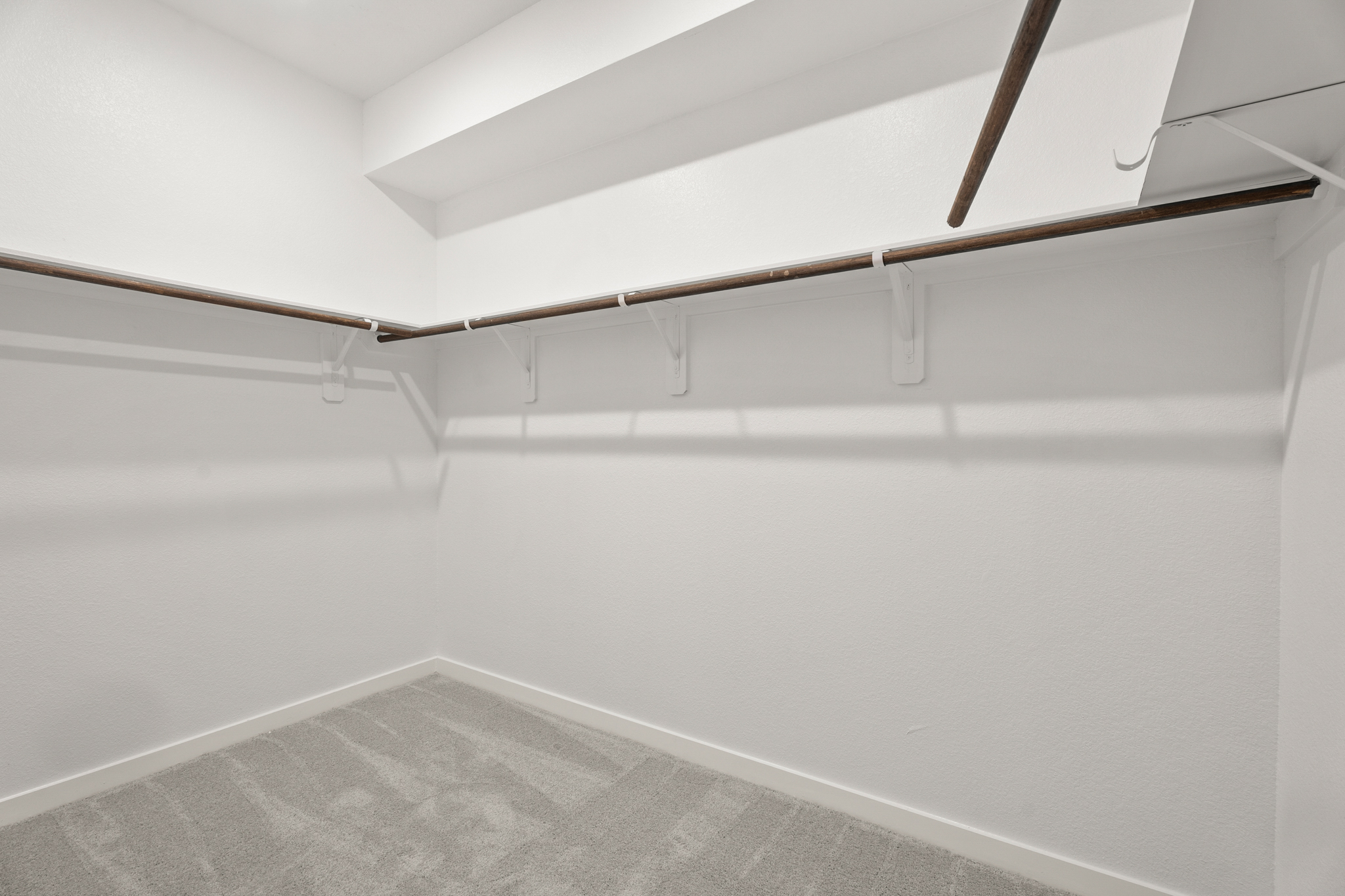 A white wall with a white floor.