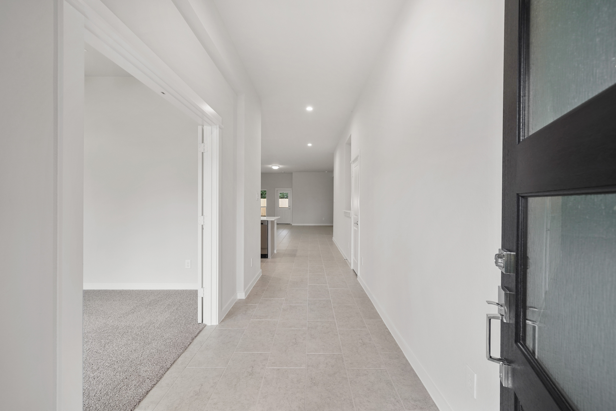 A hallway with white walls.