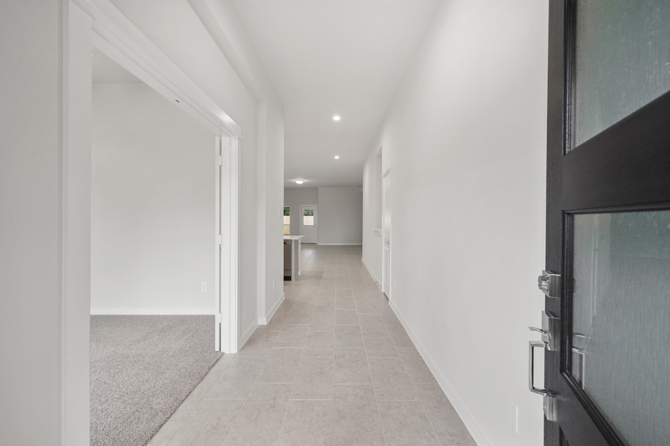 A hallway with white walls.