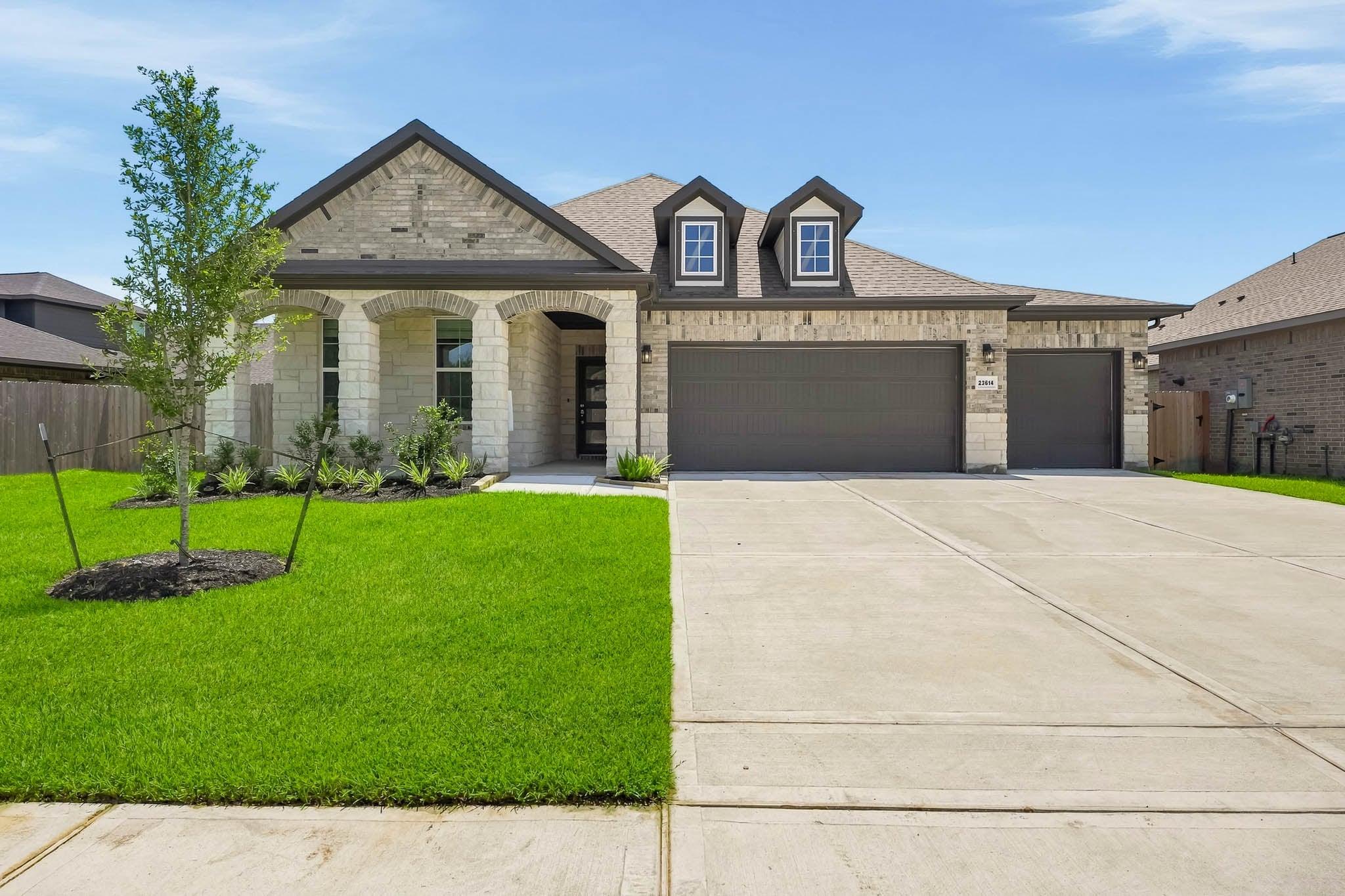 A house with a large front yard.