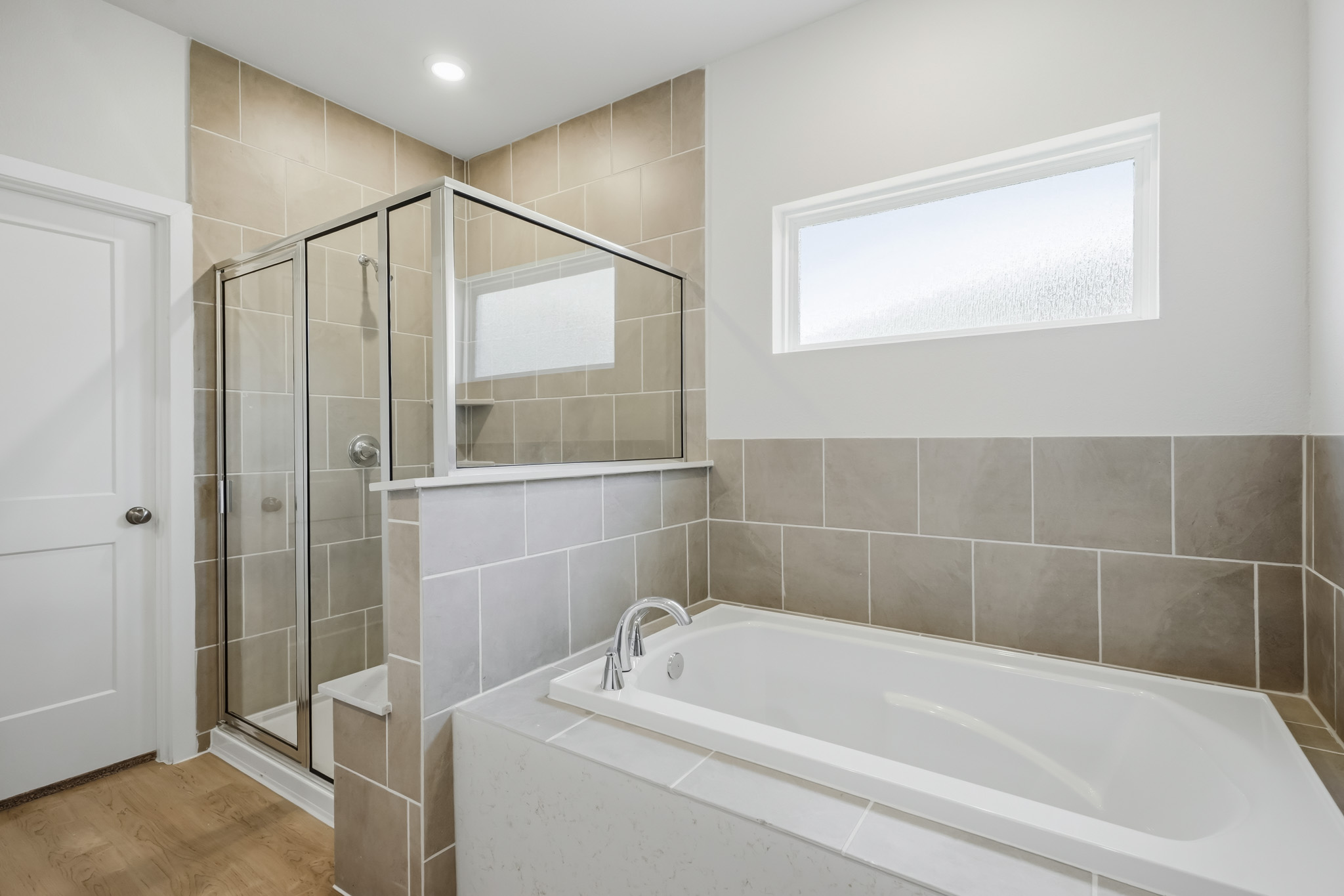 A bathroom with a glass shower.