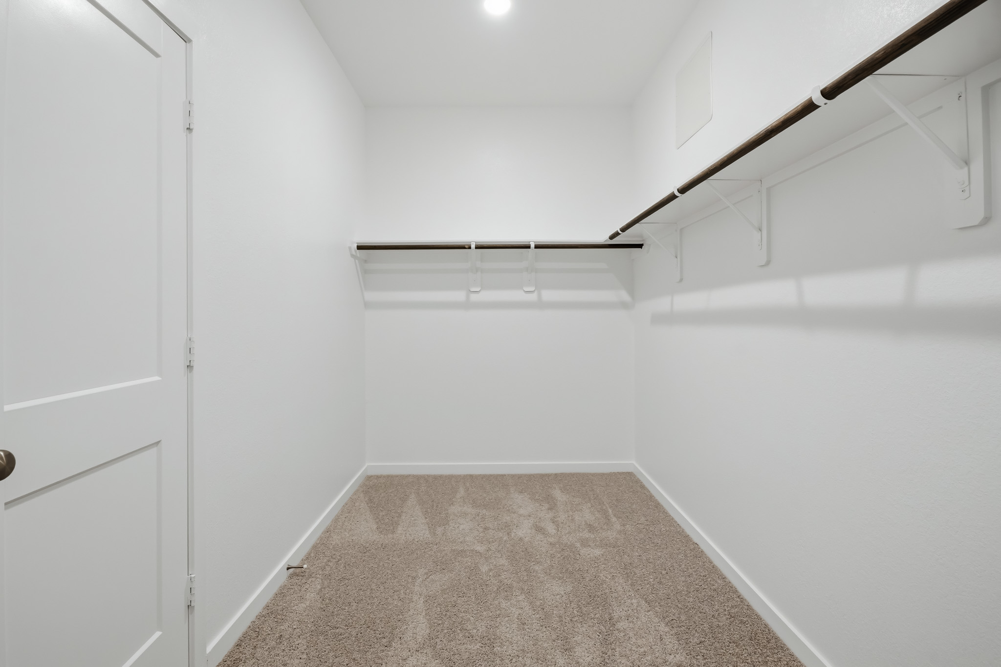 A hallway with white walls.