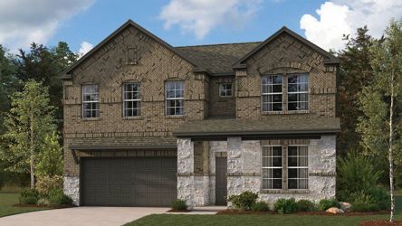 A stone house with a garage.