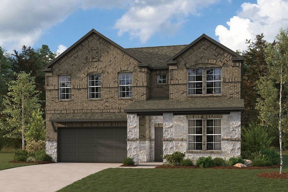 A stone house with a garage.