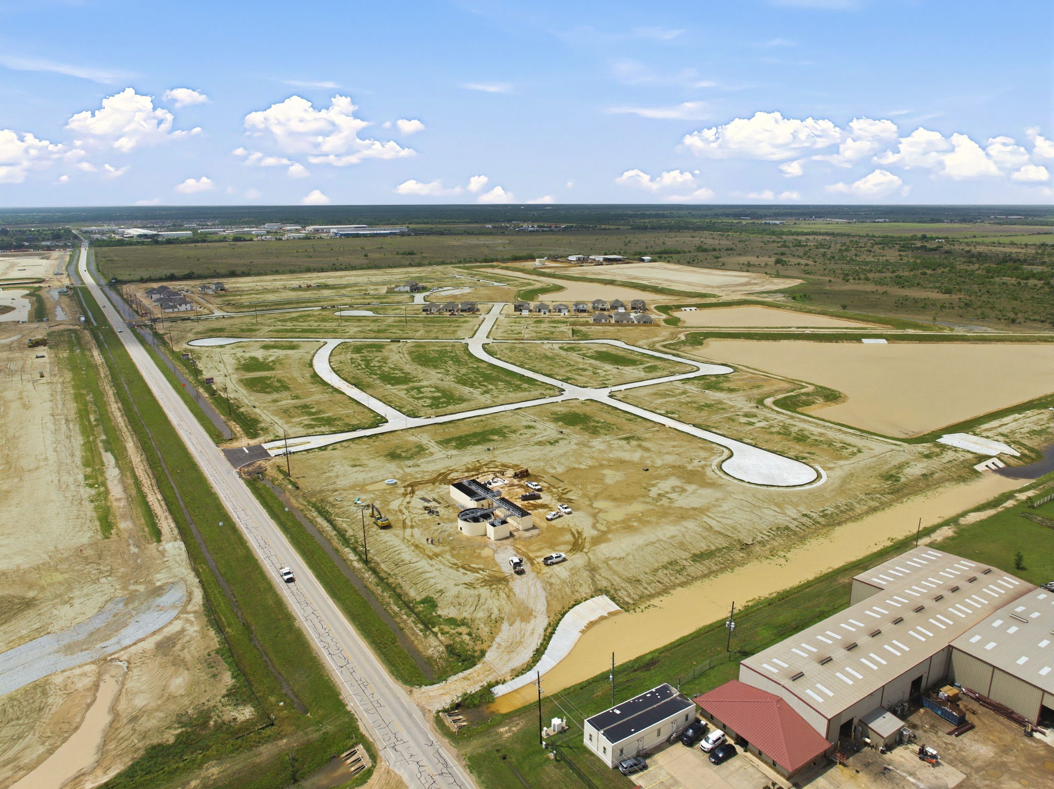 A large open field with many buildings.