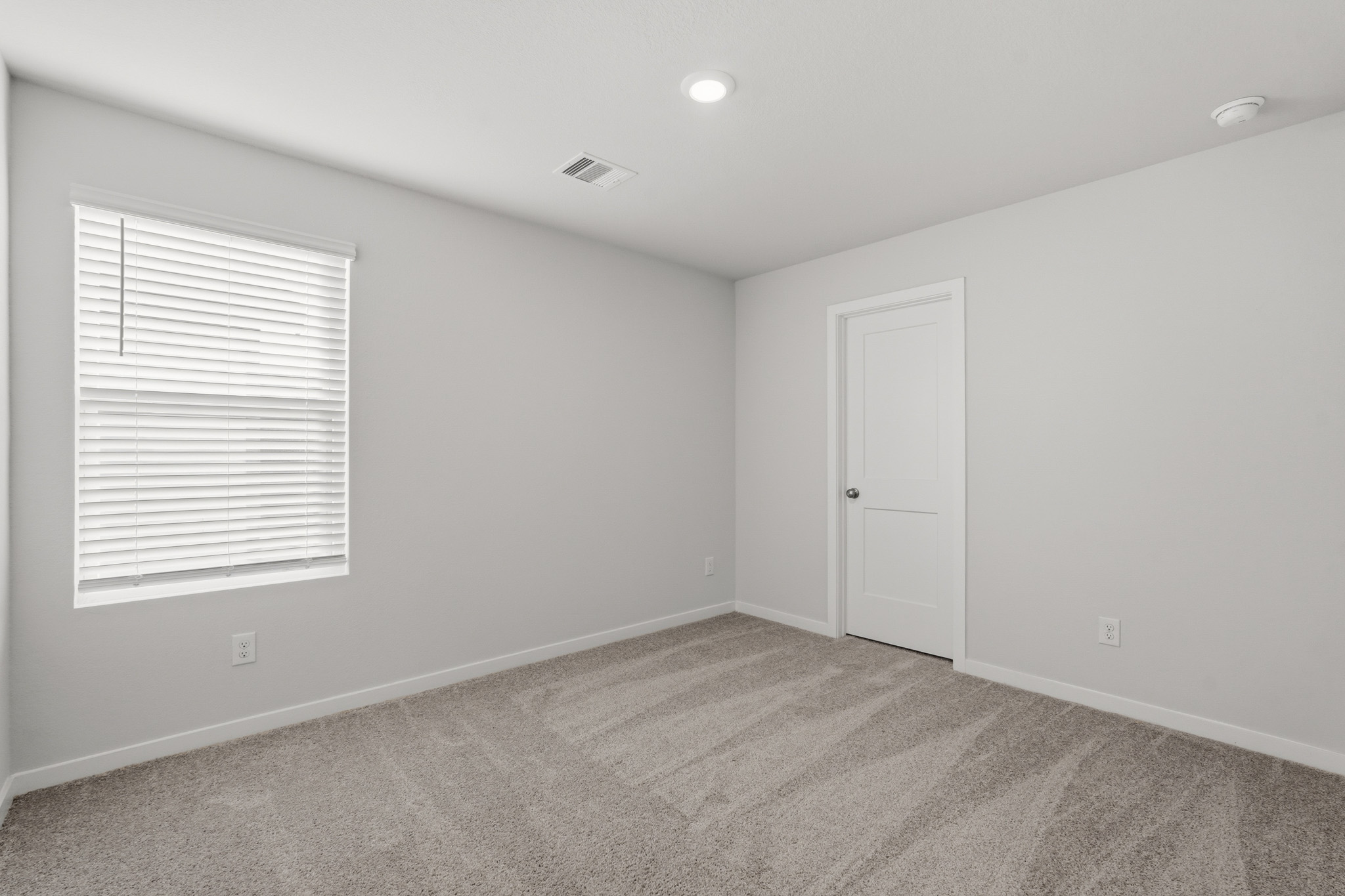 A room with a door and a window.