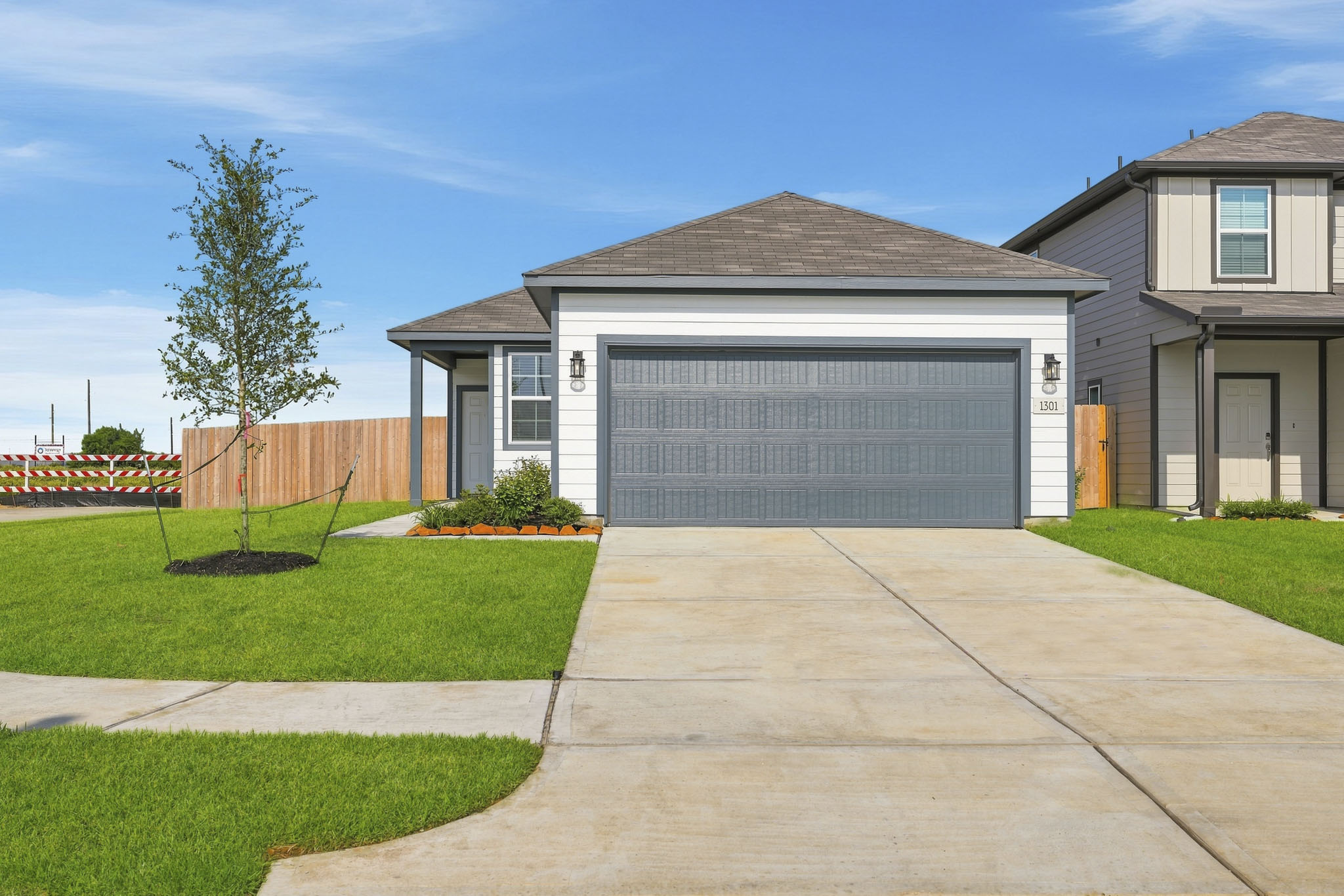 A driveway leading to a house.