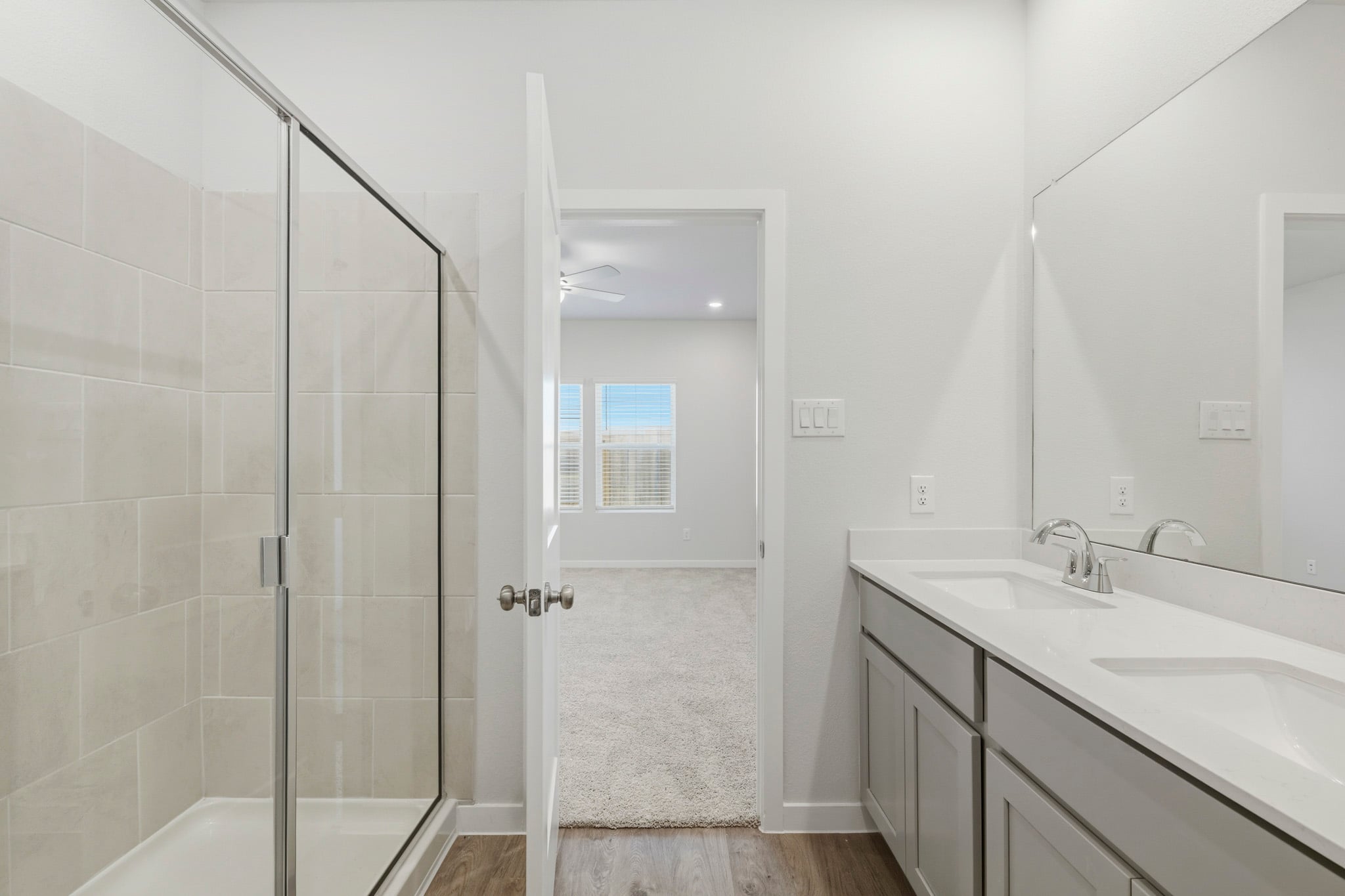 A bathroom with a glass shower.