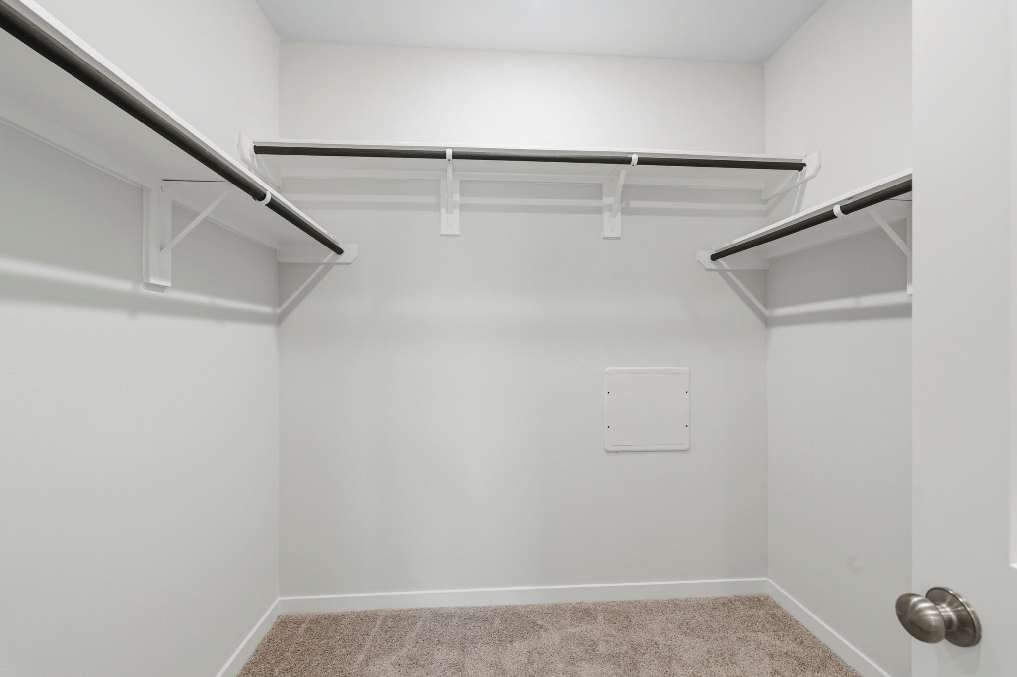A white room with a staircase.