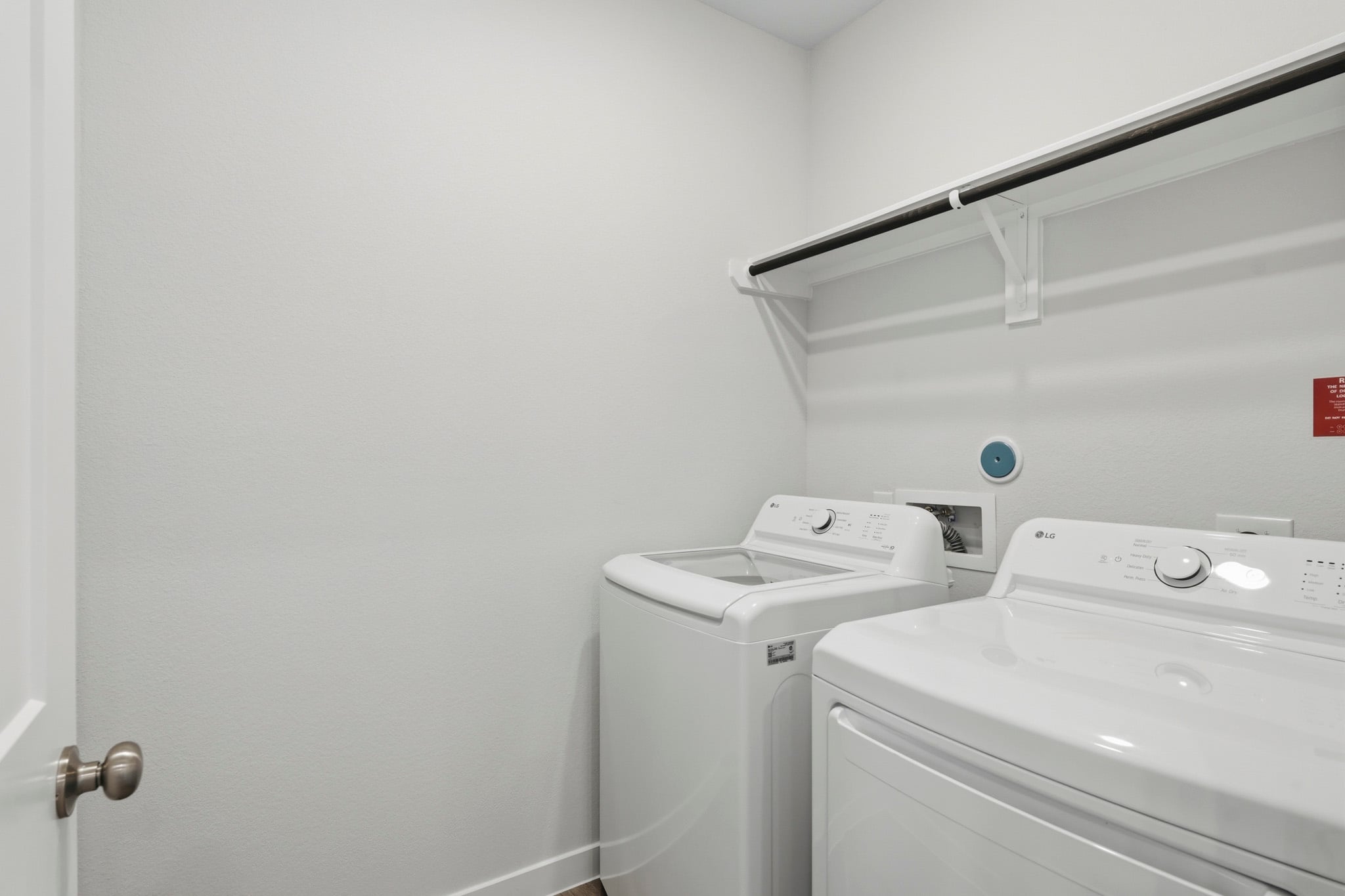 A washing machine in a room.