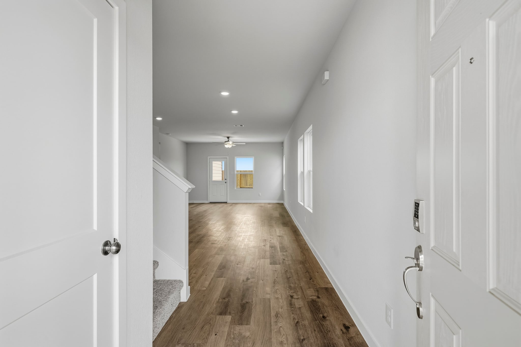 A hallway with white doors.