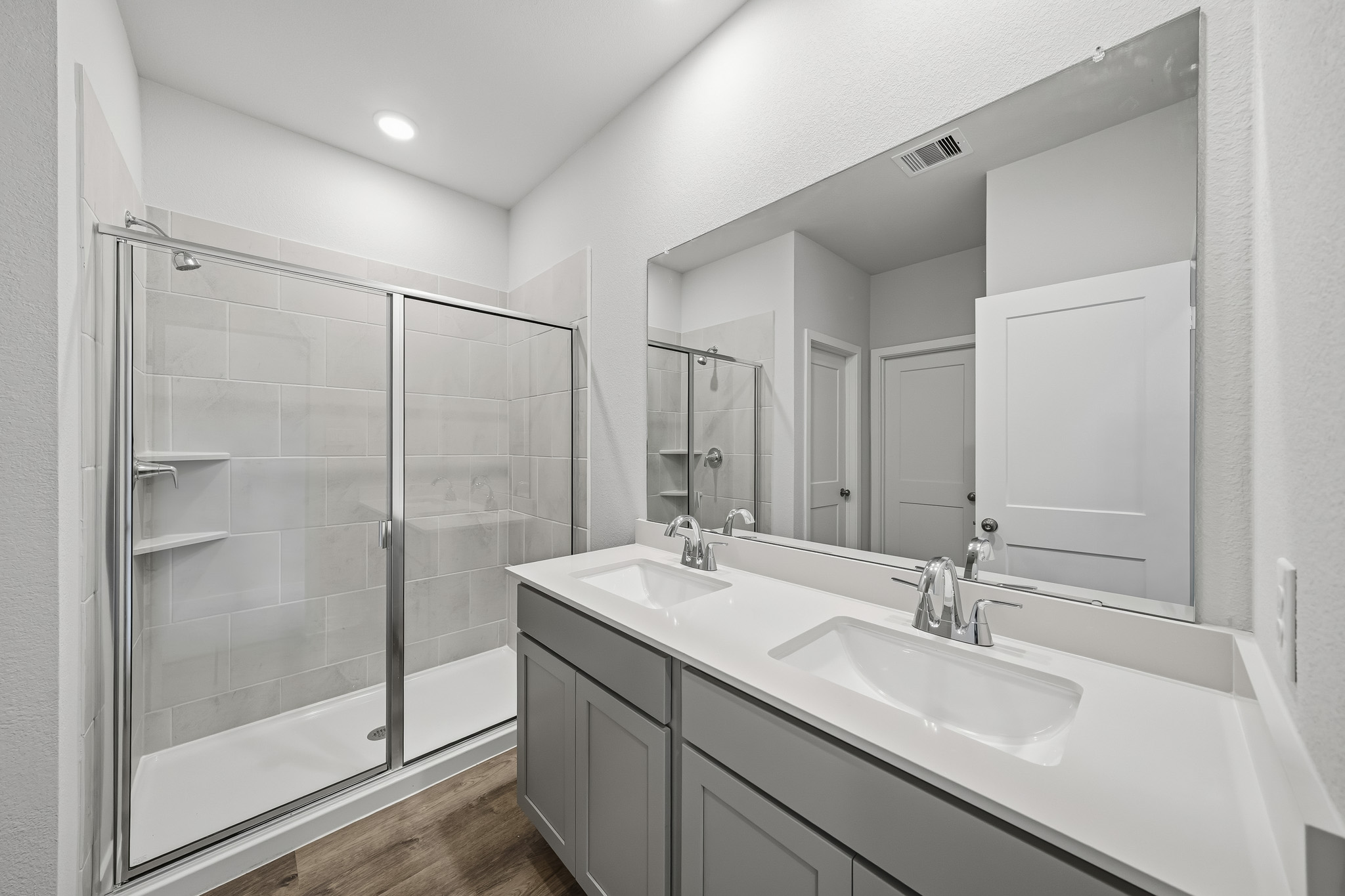 A bathroom with a glass shower.