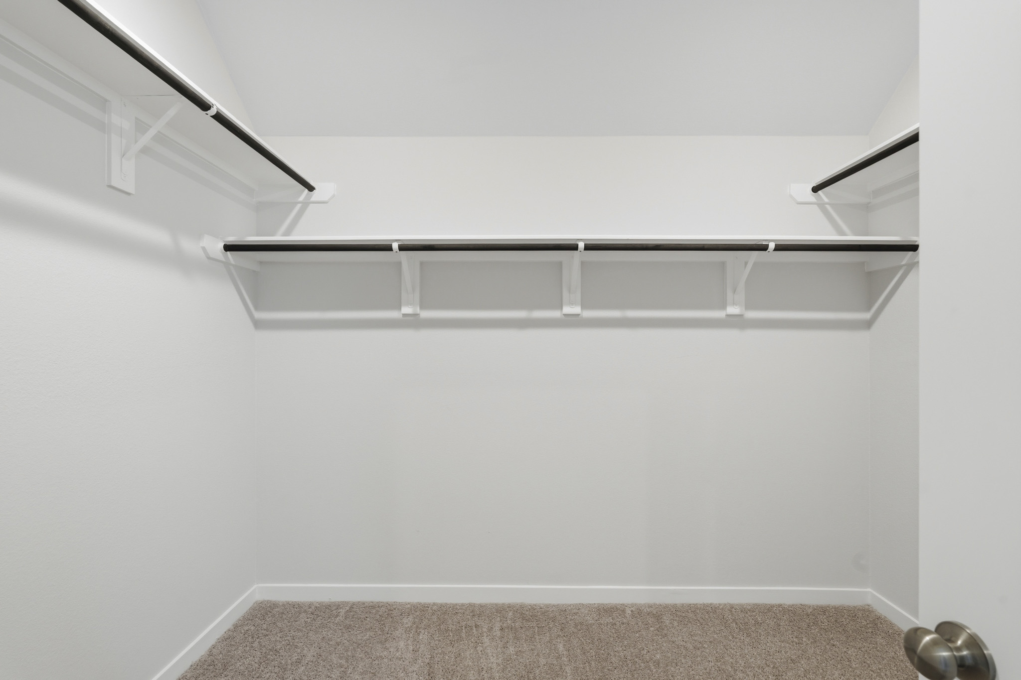 A white shelf with a light.