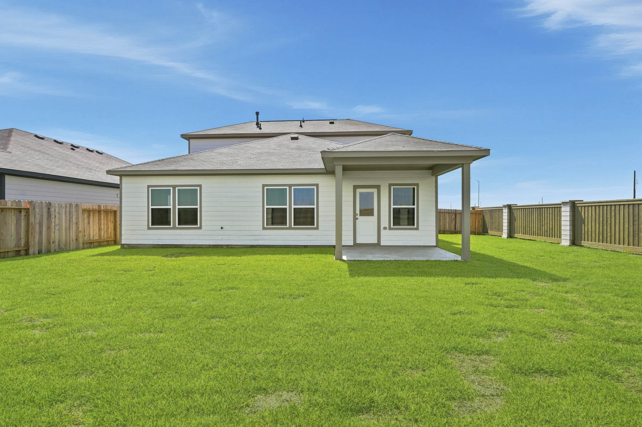 A house with a fence around it.