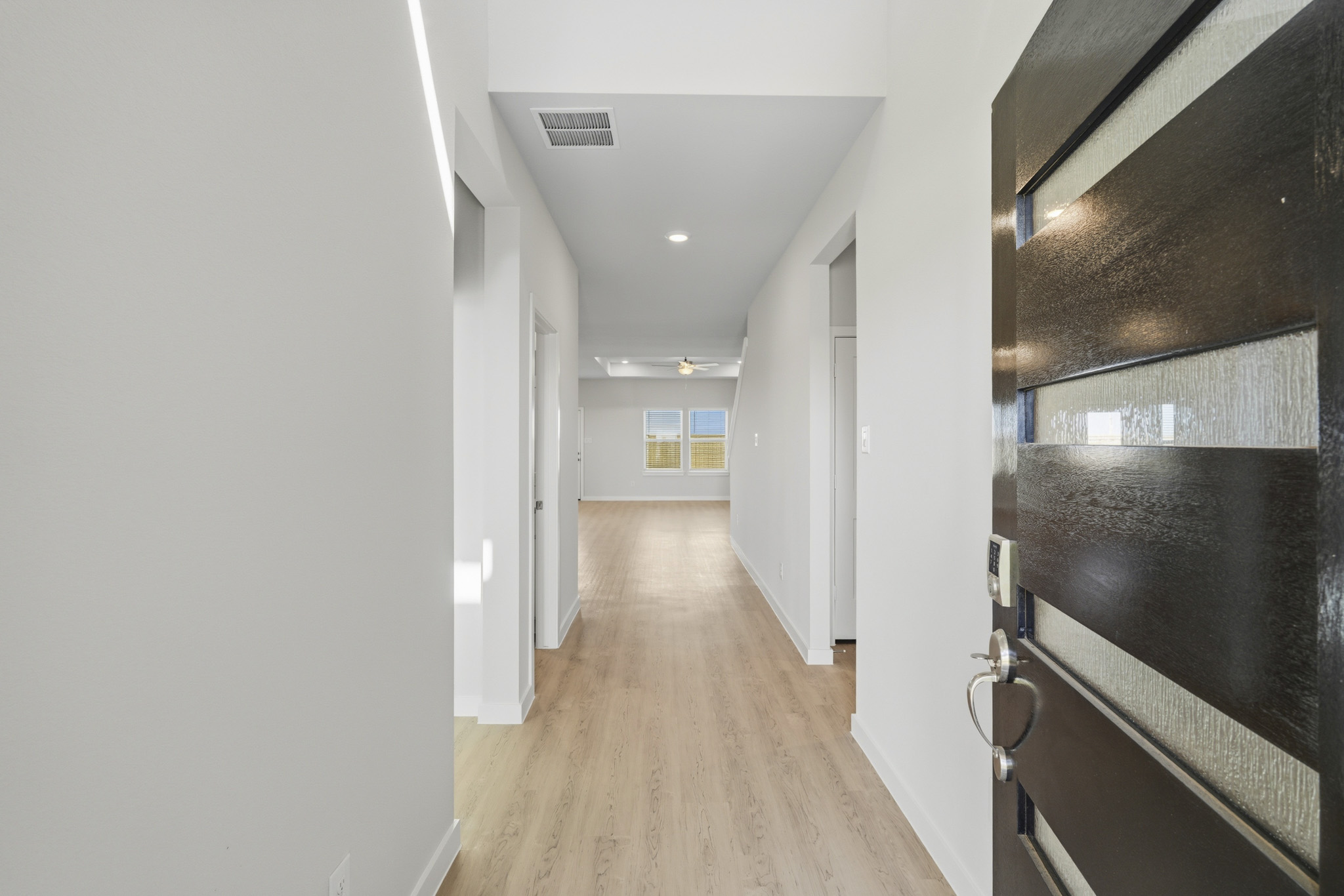 A hallway with white walls.