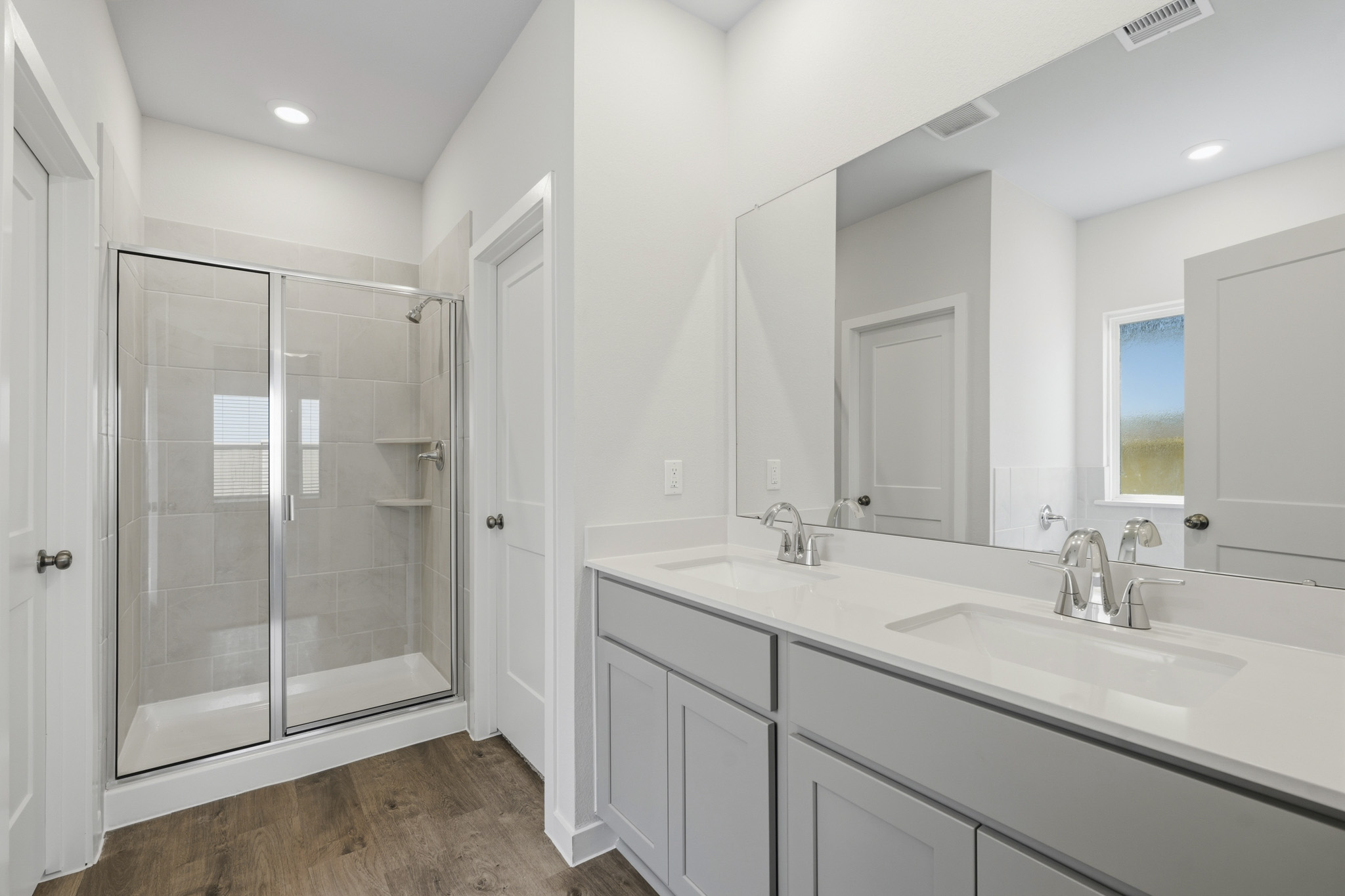 A bathroom with a glass shower.