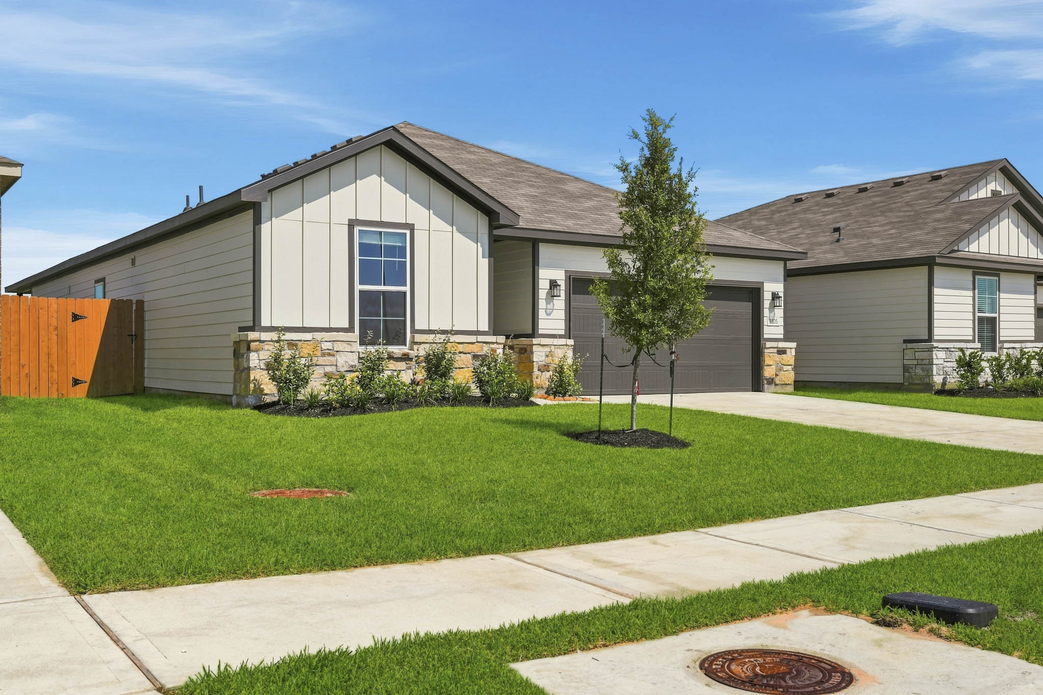 A house with a lawn and trees.