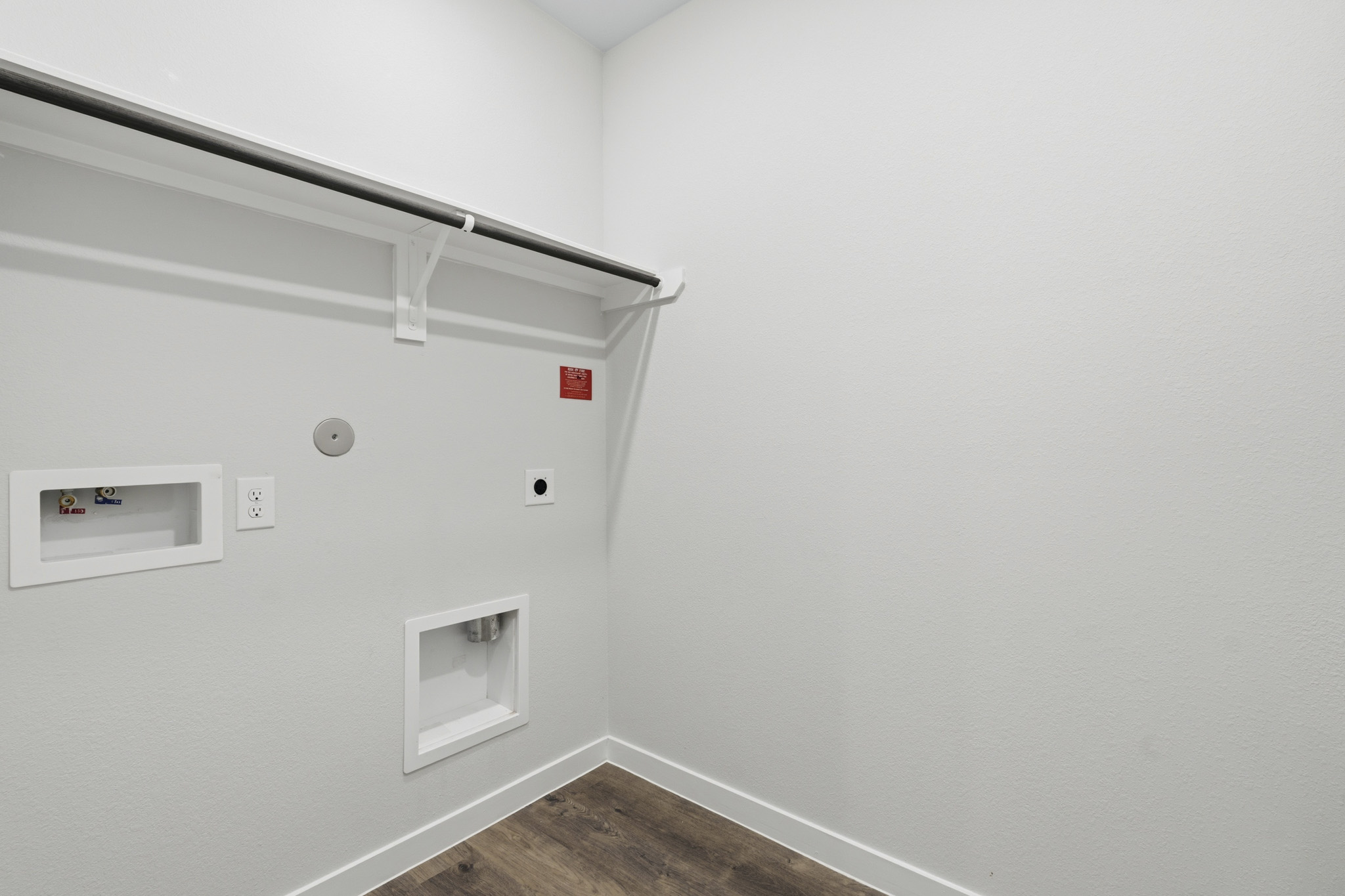 A white wall with a light on it.