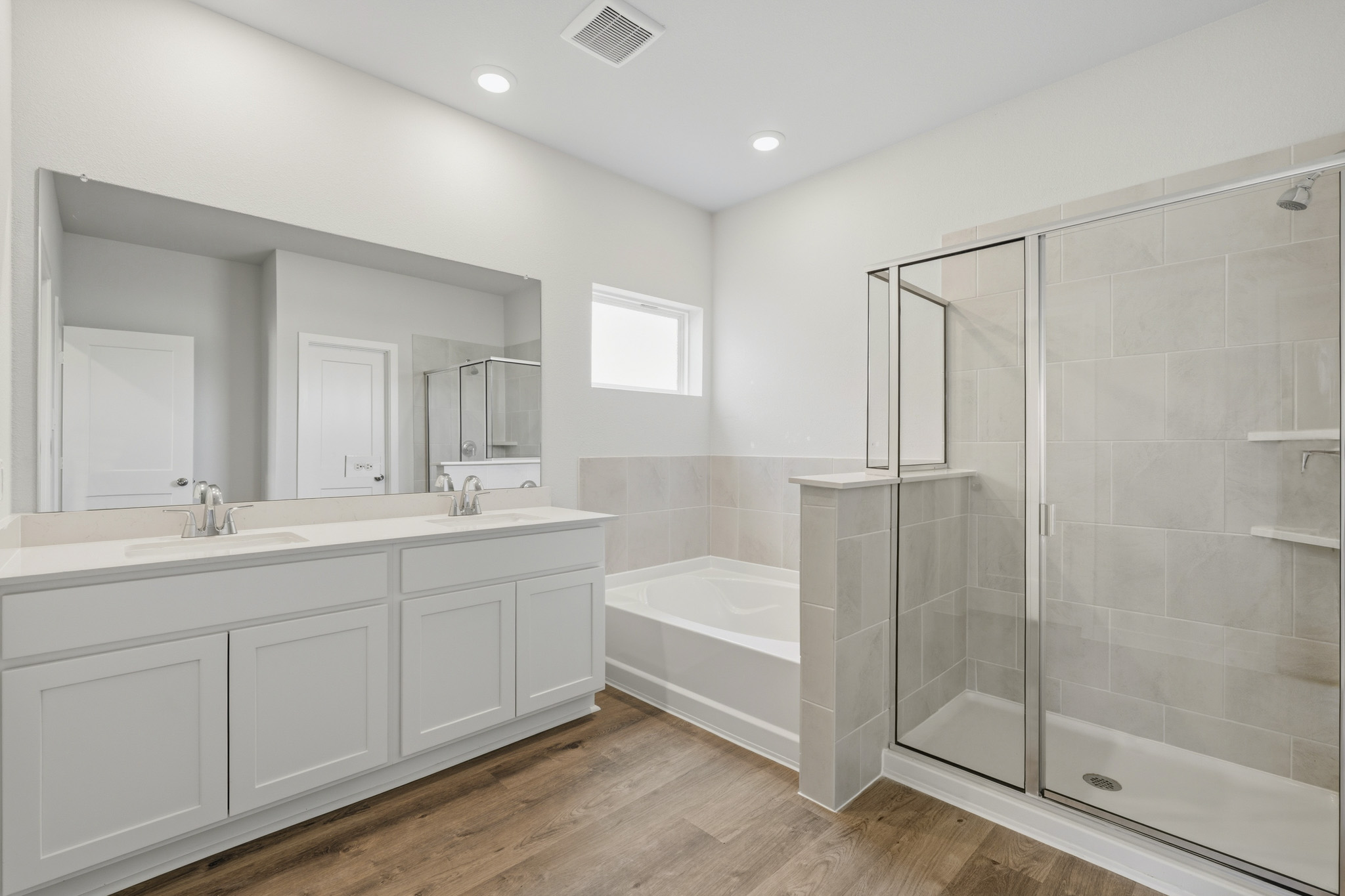 A bathroom with a glass shower.