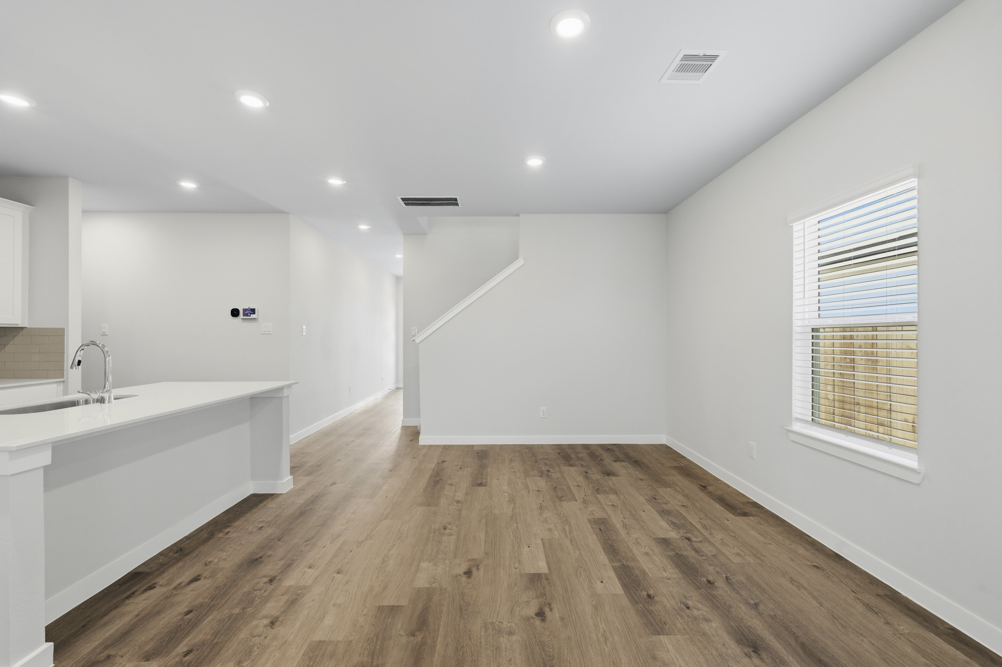 A bathroom with a wood floor.