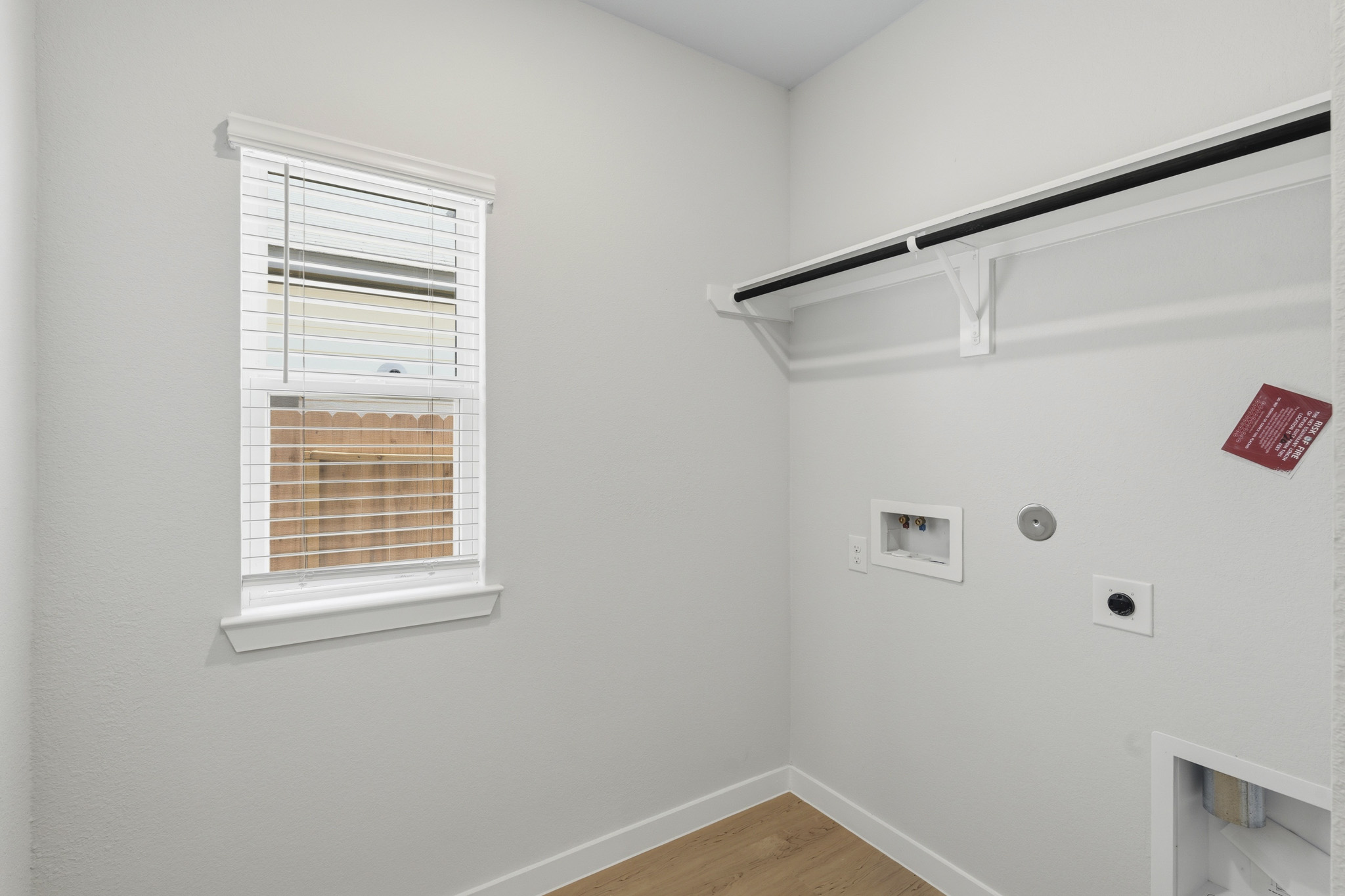 A white room with a window.