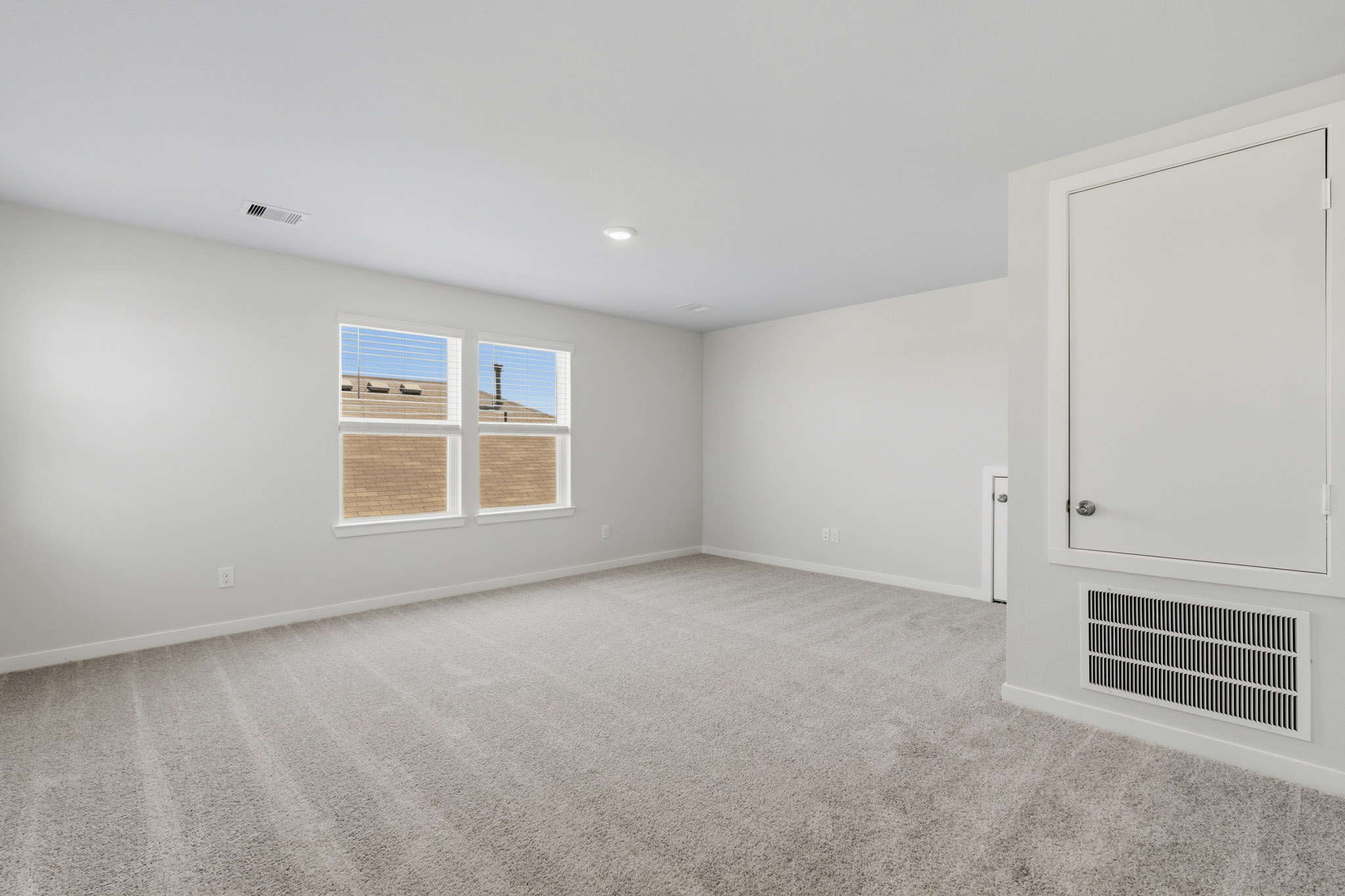 A room with a window and a door.