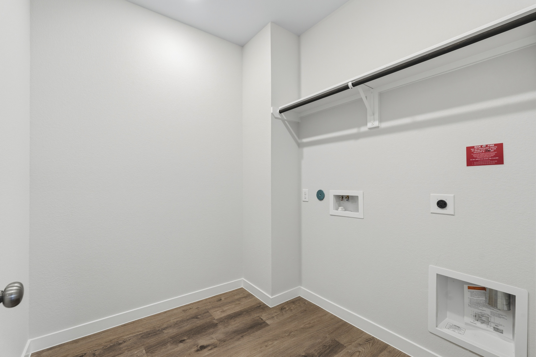 A white wall with a vent.