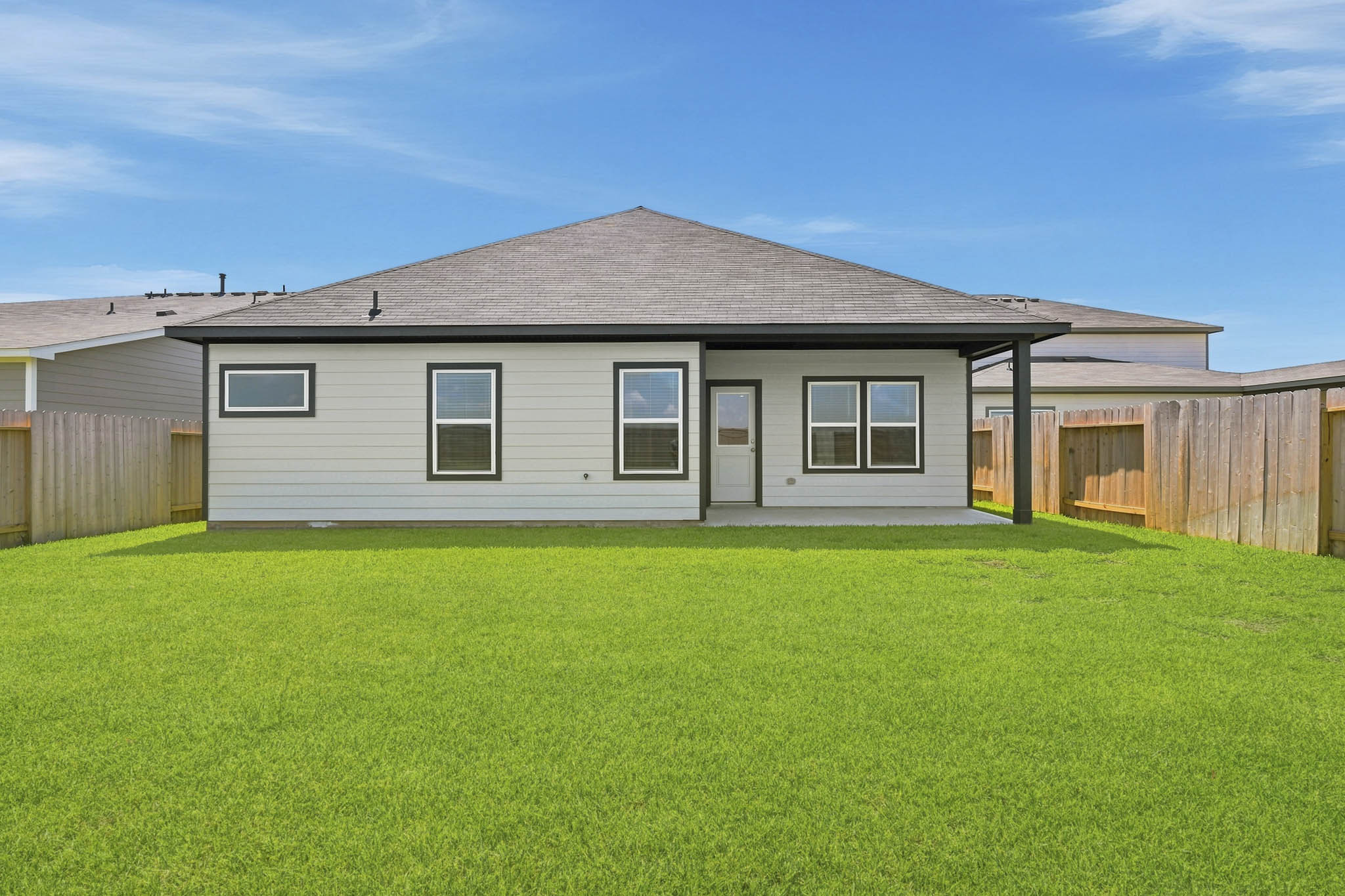 A house with a grass yard.
