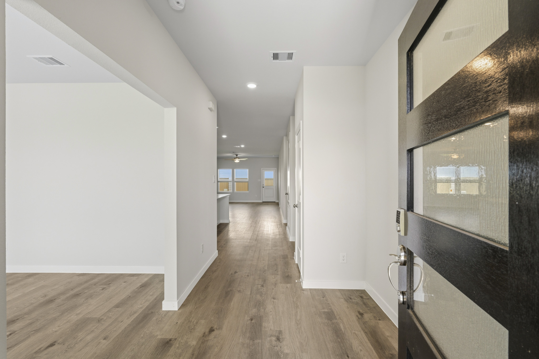 A hallway with white walls.
